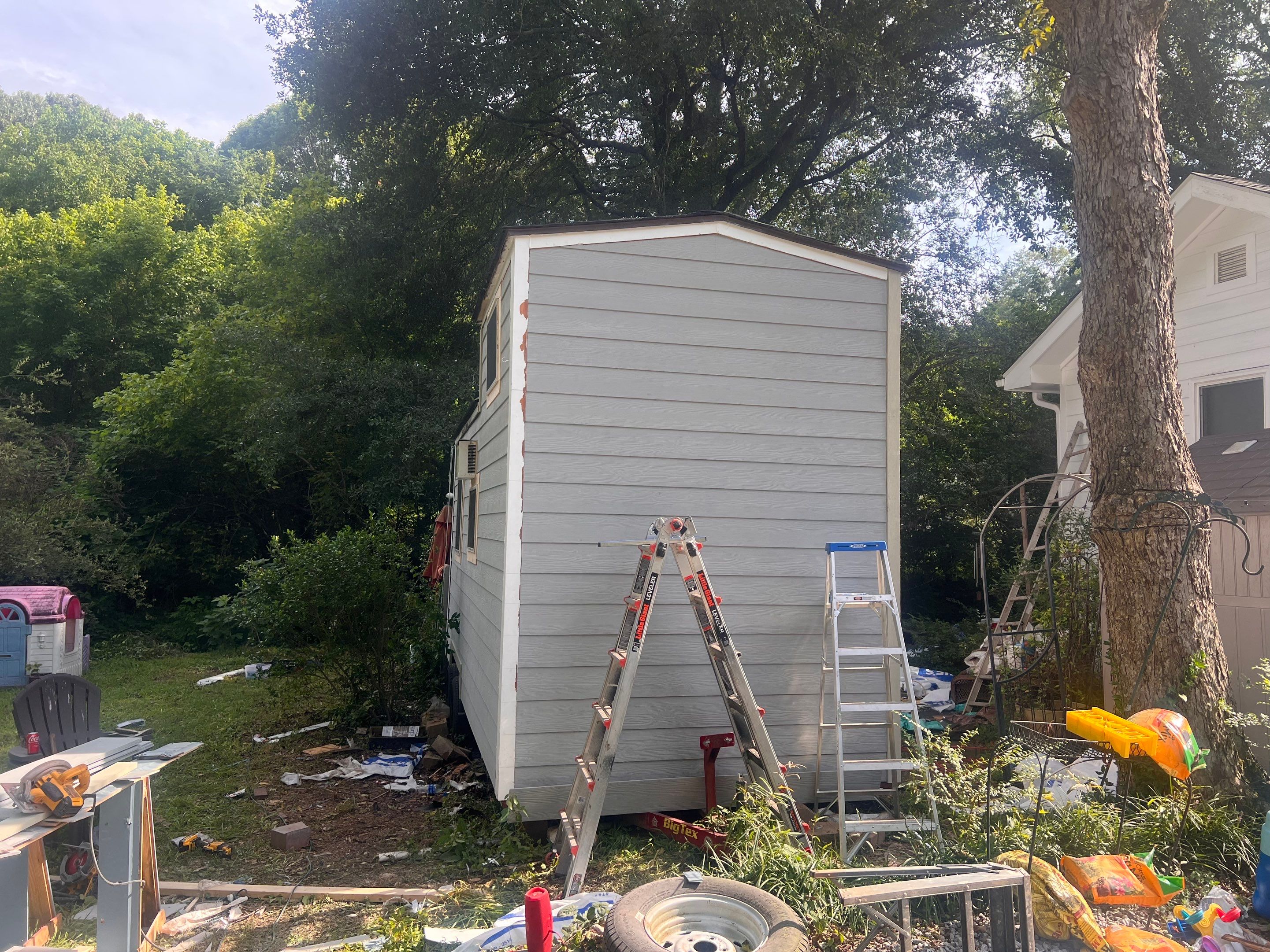 tiny home remodel- siding,paint,roofing by Nailed It Roofing & Remodeling LLC