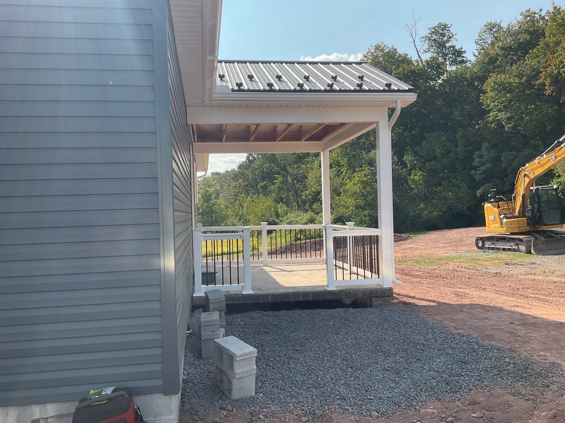 New Residential Addition with Blue Siding and Metal Roofing in Ashland by Esh Builders