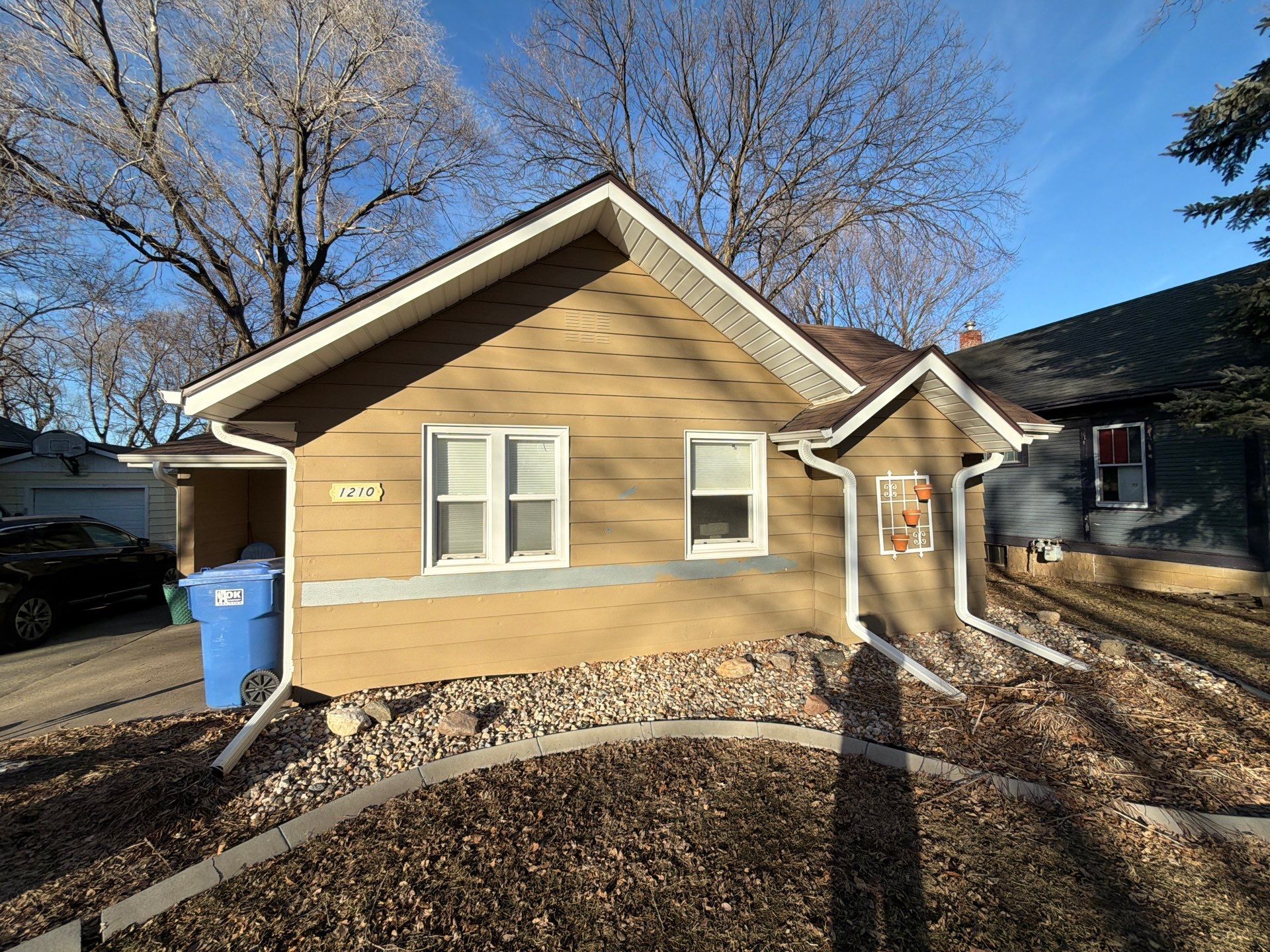 Exterior Siding Repair and Full House Repaint in Sioux Falls by Select Painting, Coatings & Garage Cabinets