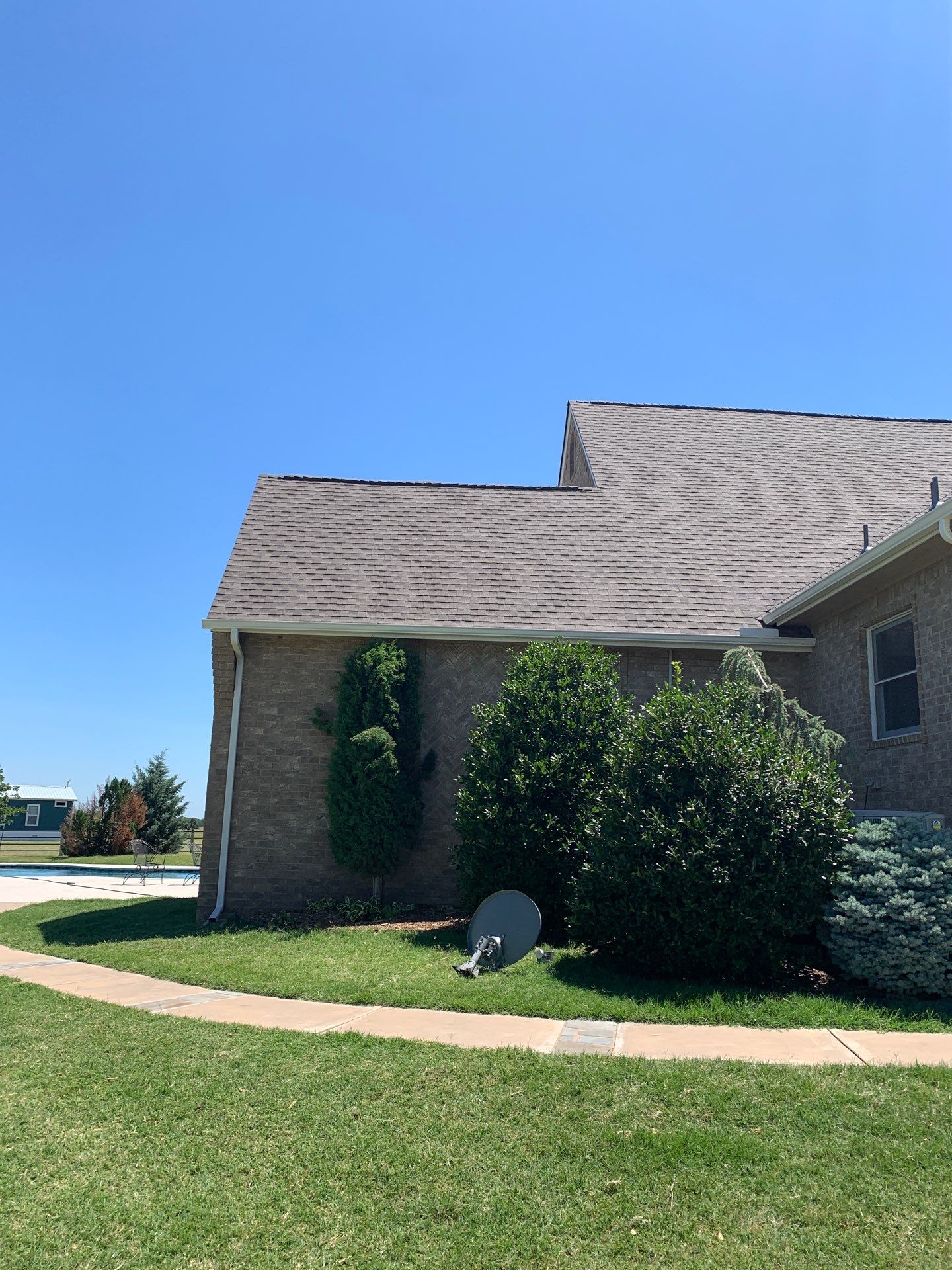 Roof Replacement and Gutter Installation in Edmond, OK by McCann's Roofing and Construction