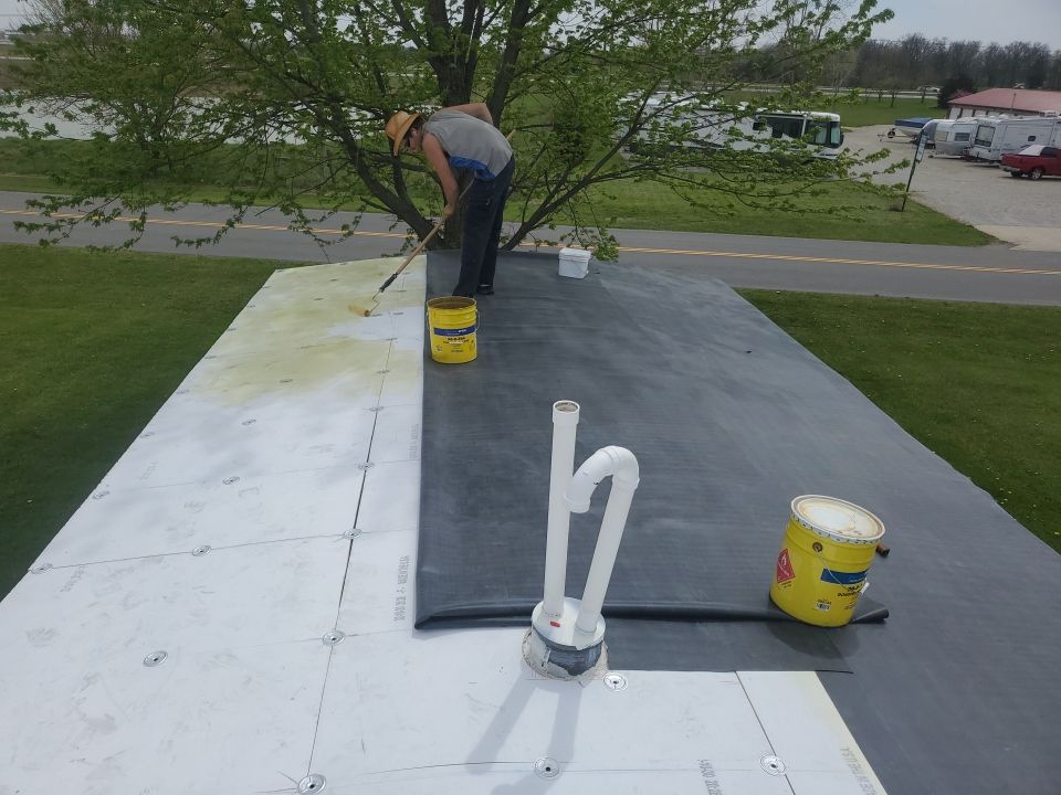 Residential Roofing Installation using 60 mil rubber roof  by Nitro Roofing and Construction