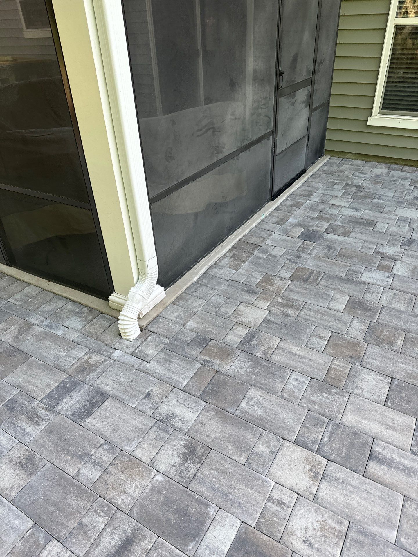 Custom Paver Patio Extension and Circular Fire Pit in Bluffton by Lowcountry Scapes, LLC