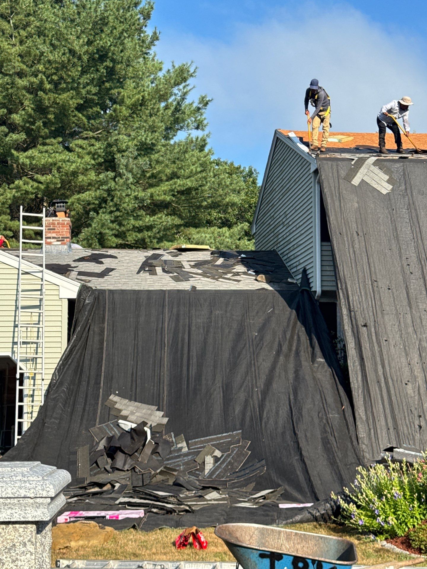 Complete Roof Replacement with Chimney Flashing, Gutter Guard System, and Vinyl Siding Repairs by Mighty Dog Roofing of Greater Middlesex County