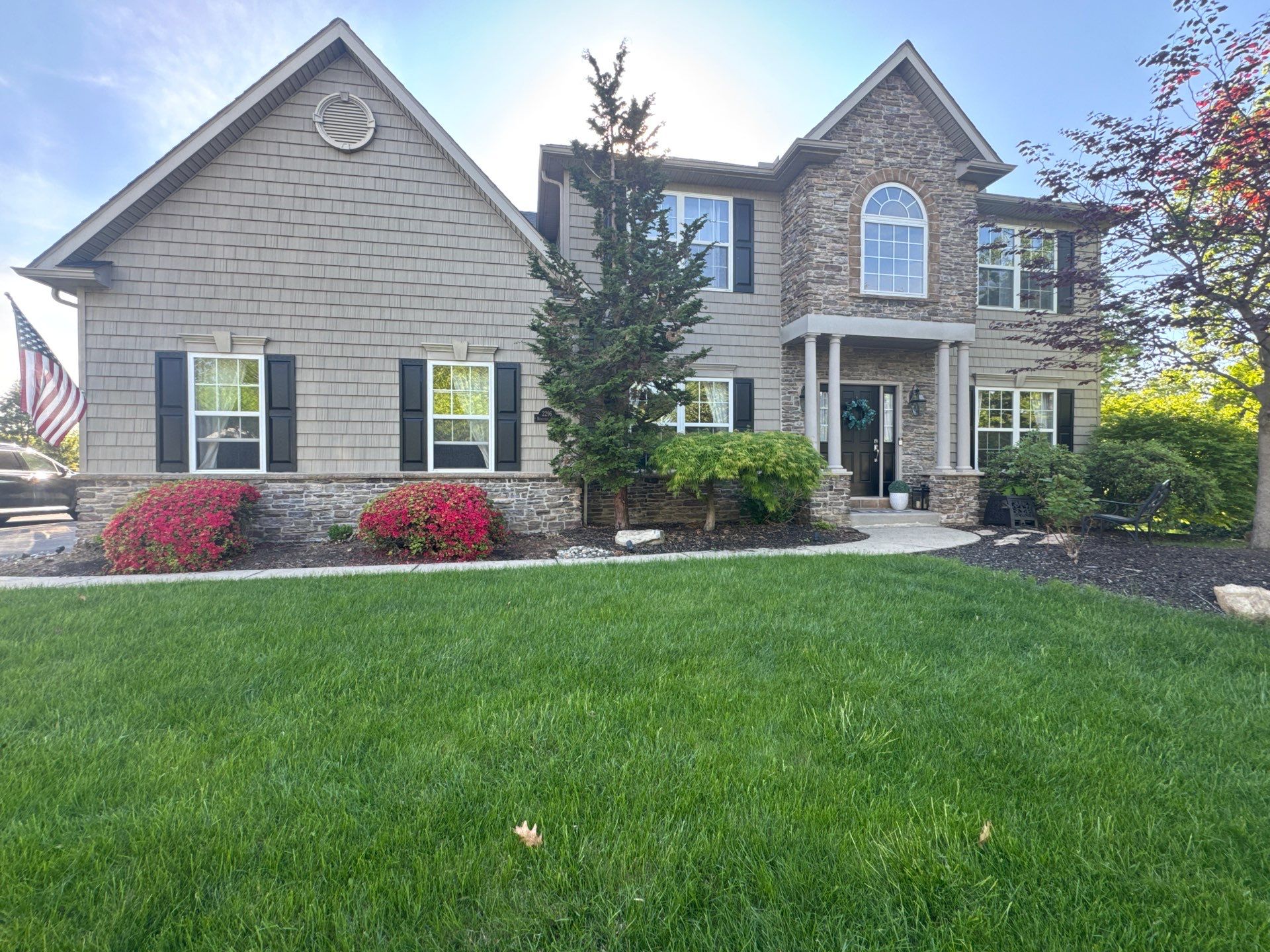 Backyard Retreat: Techo-Bloc Patio + Firepit Lounge by Saylor’s Lawn & Landscape