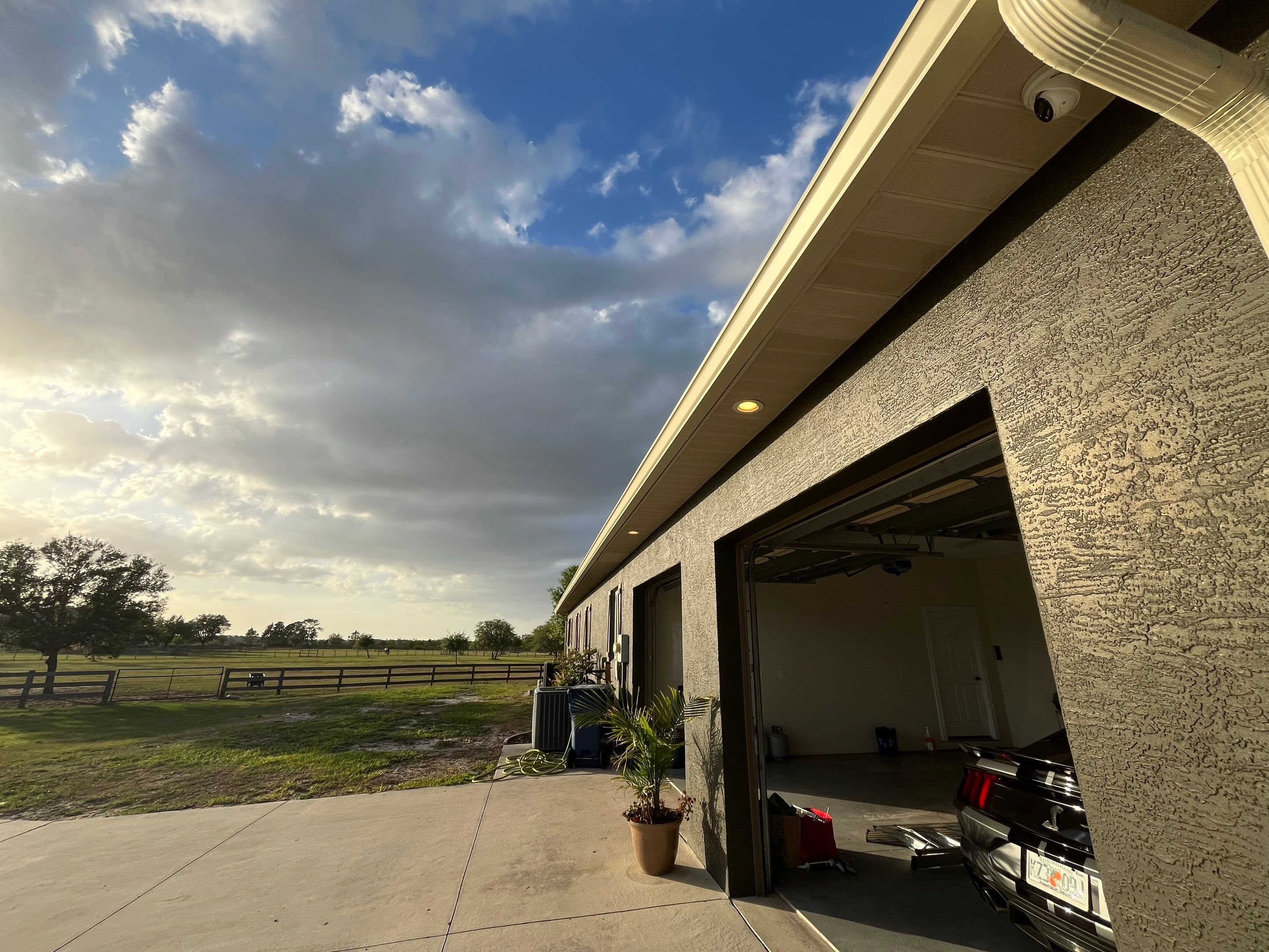  7-inch White seamless gutters and downspouts in Myakka City FL by Gutter Professors