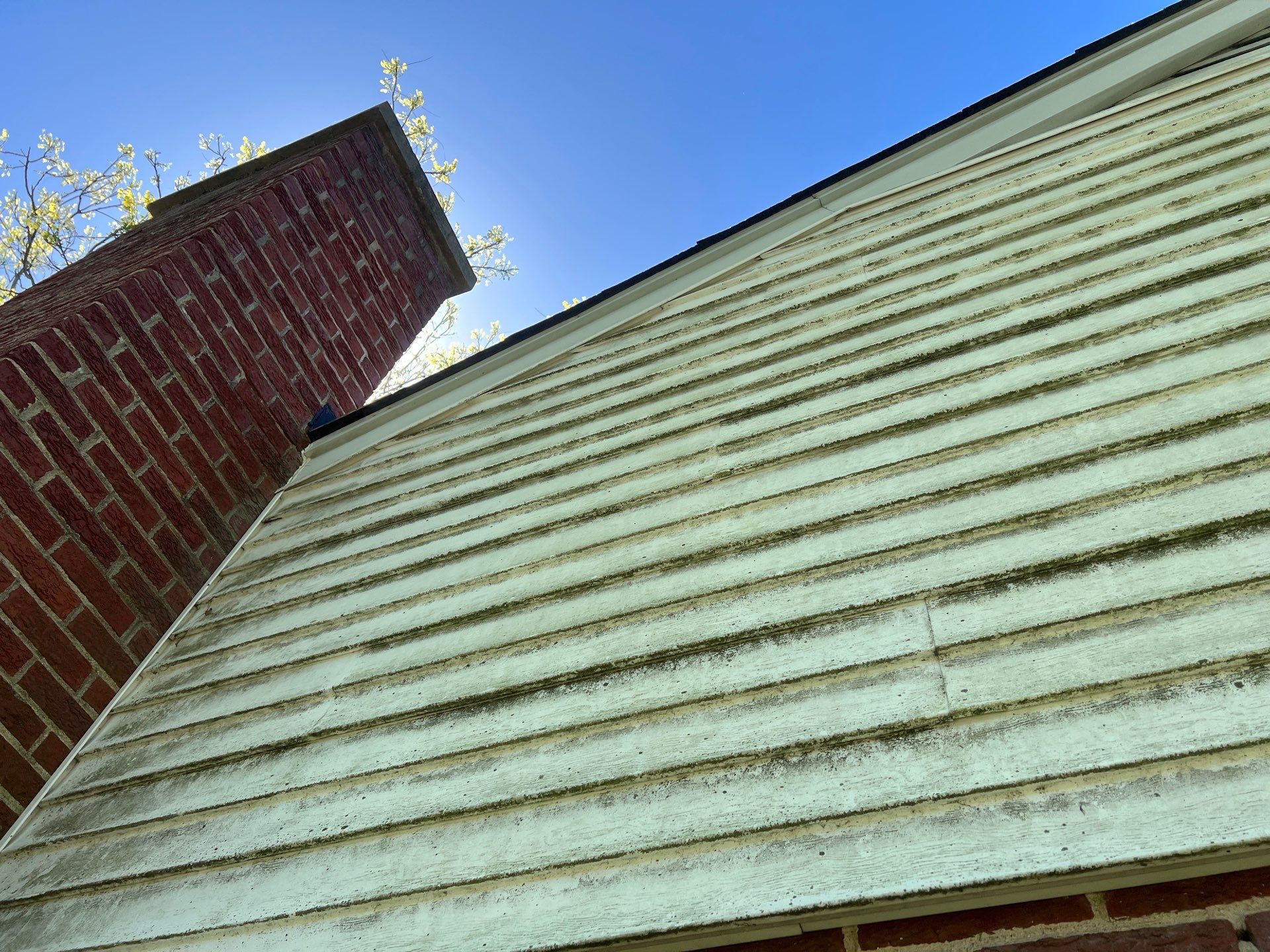Housewashing  using Algaecide, soft wash soap by Northern Power Washing LLC.