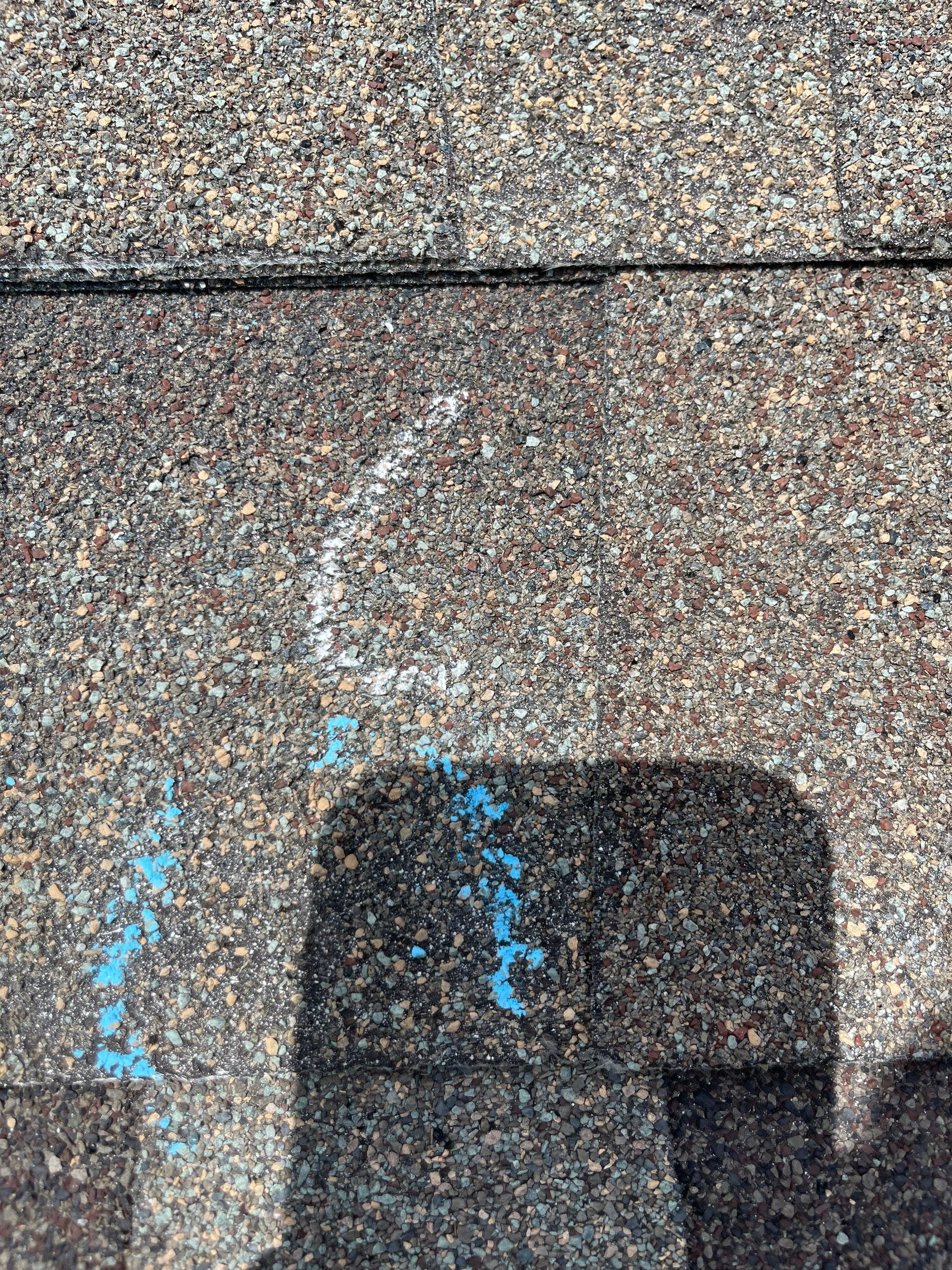 Hail Damage on a Roofing System by Icon Roofing And Construction 