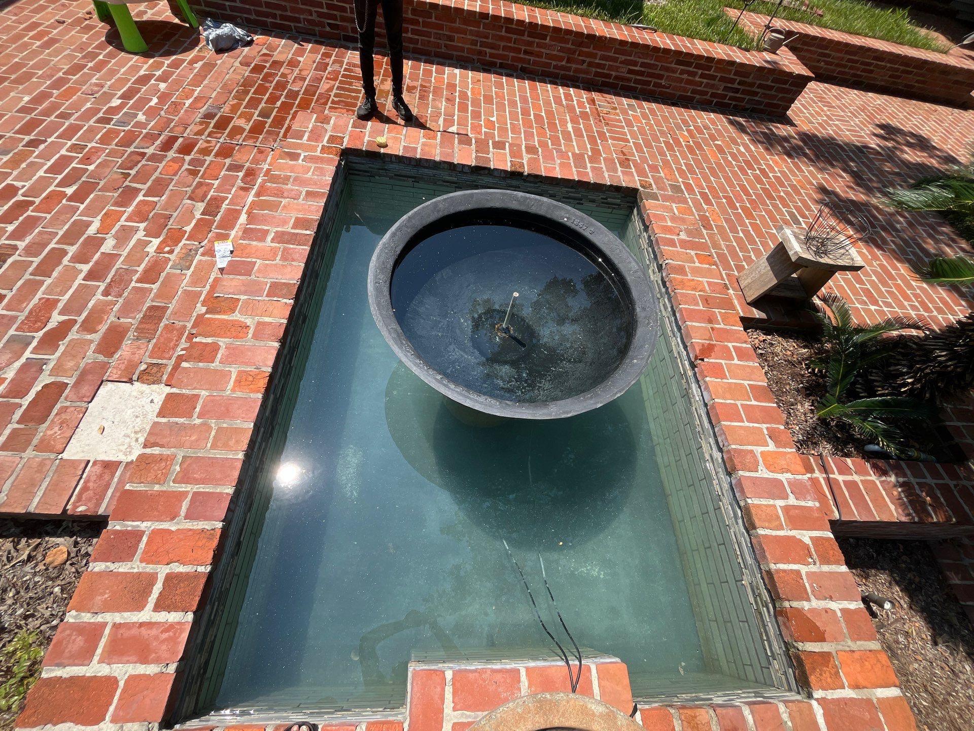 Pool Cleaning using Pool Cleaner by College Bros Outdoor services