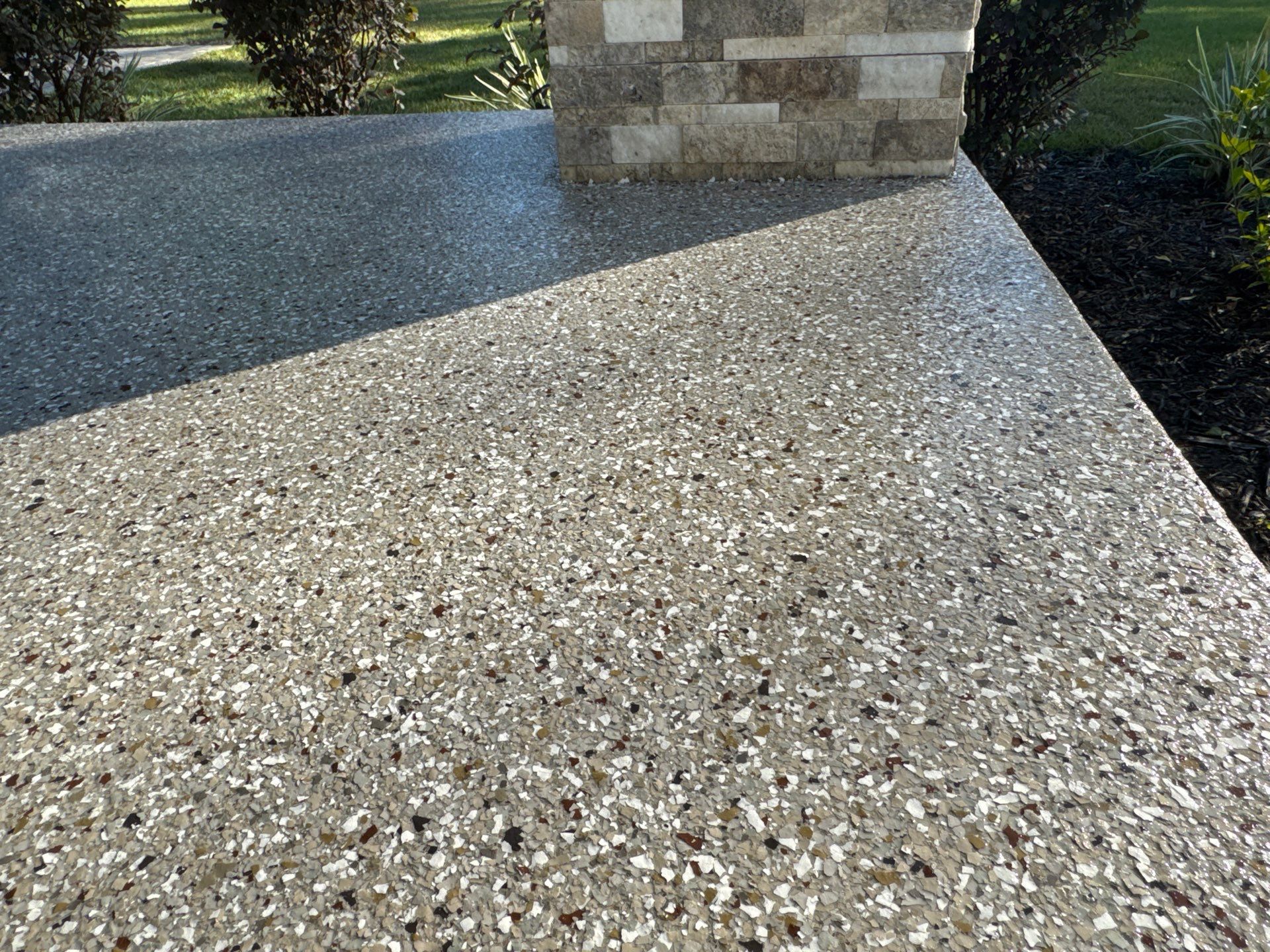 Front and Back Porches in Chiefland, FL in Pebble Beach by Cross Creek Concrete Coatings