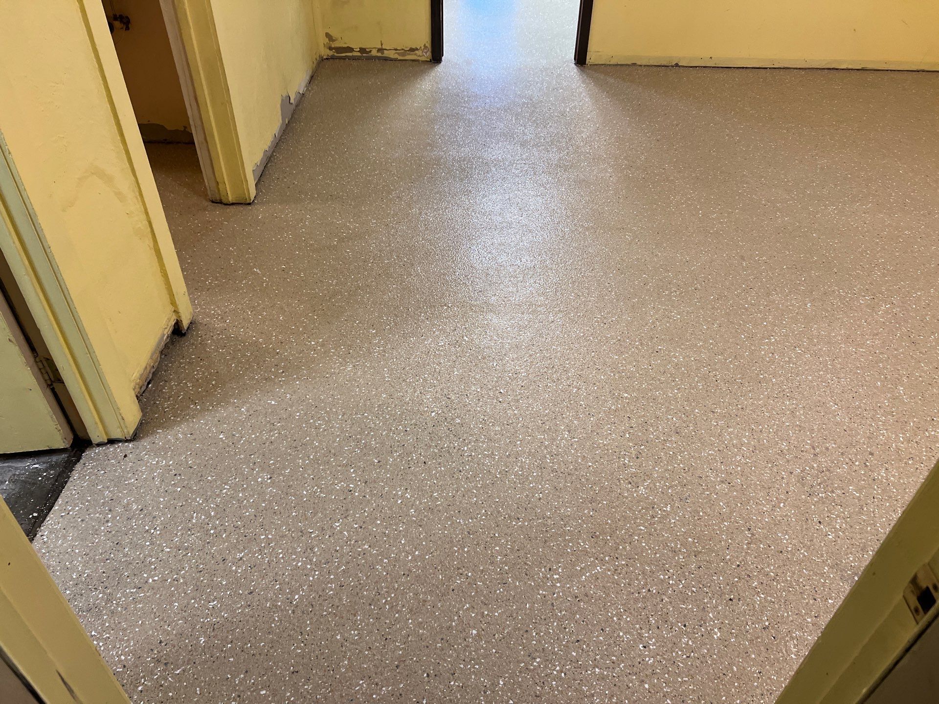 Epoxy Flooring Installation – Downtown Muskegon Commercial Space by Gordon Painting