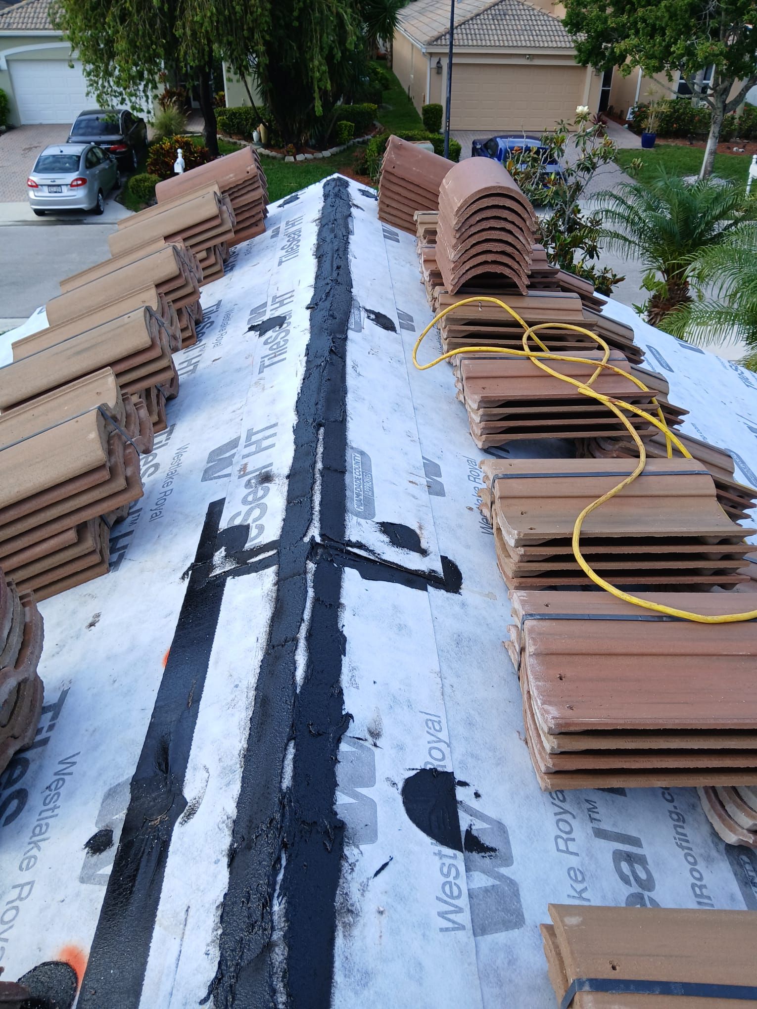 New Barrel Tile Roof Installation and Decking Repair in Boynton Beach by Aastro Roofing