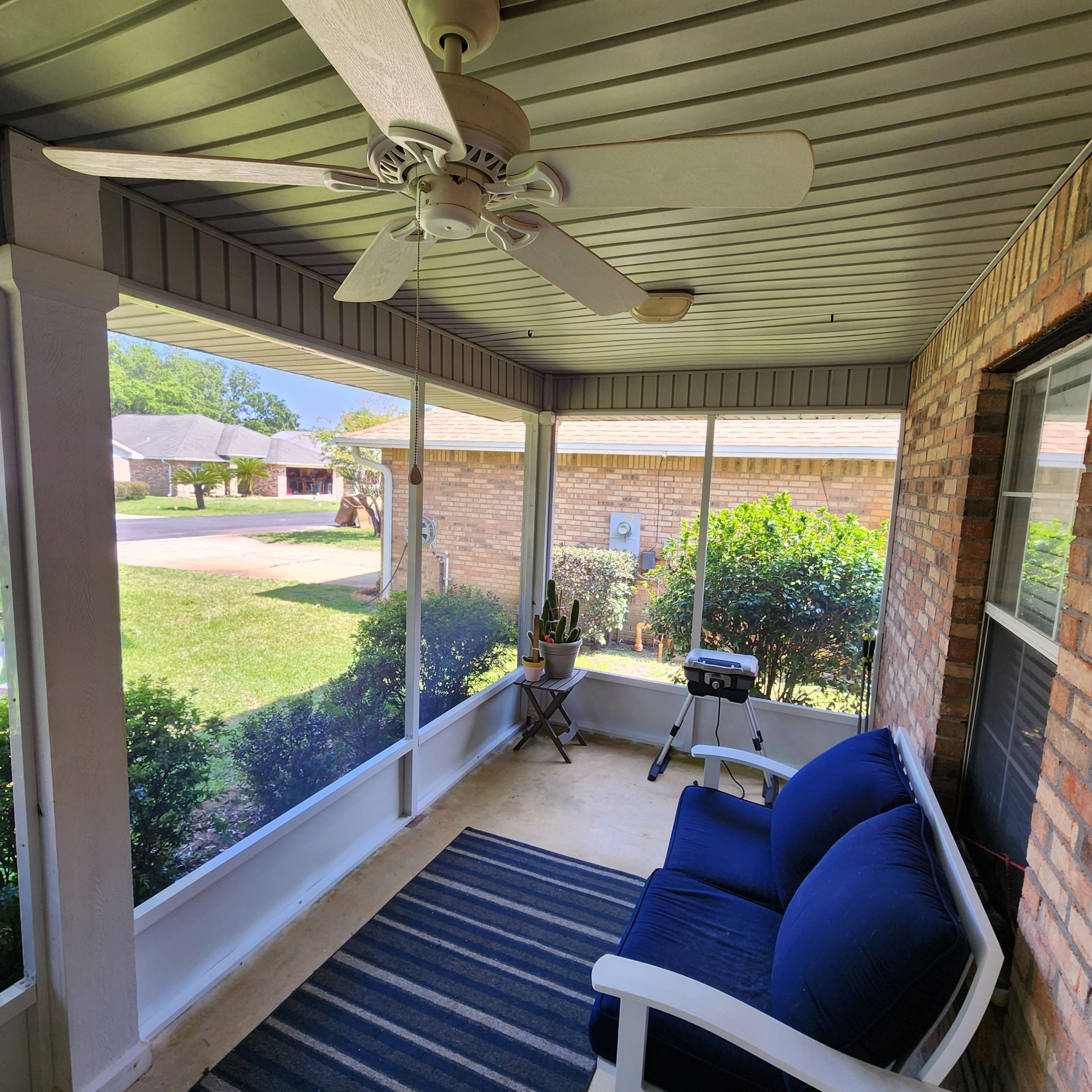 Screen Under Existing Patio Cover by Titan Sunrooms