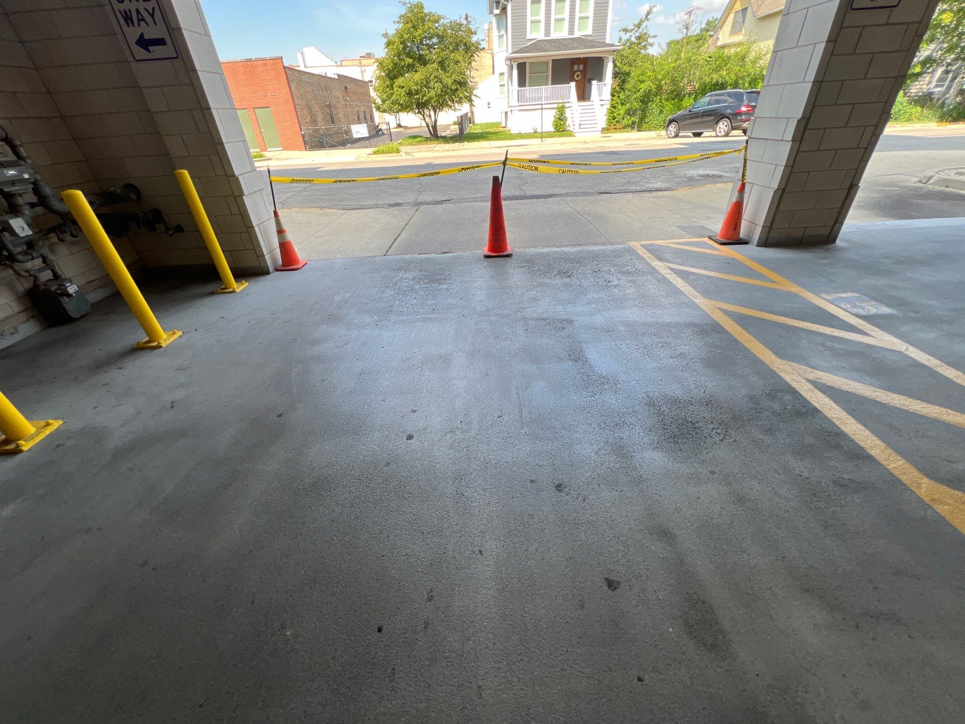 Parking garage using Hot water by Northern Power Washing LLC.