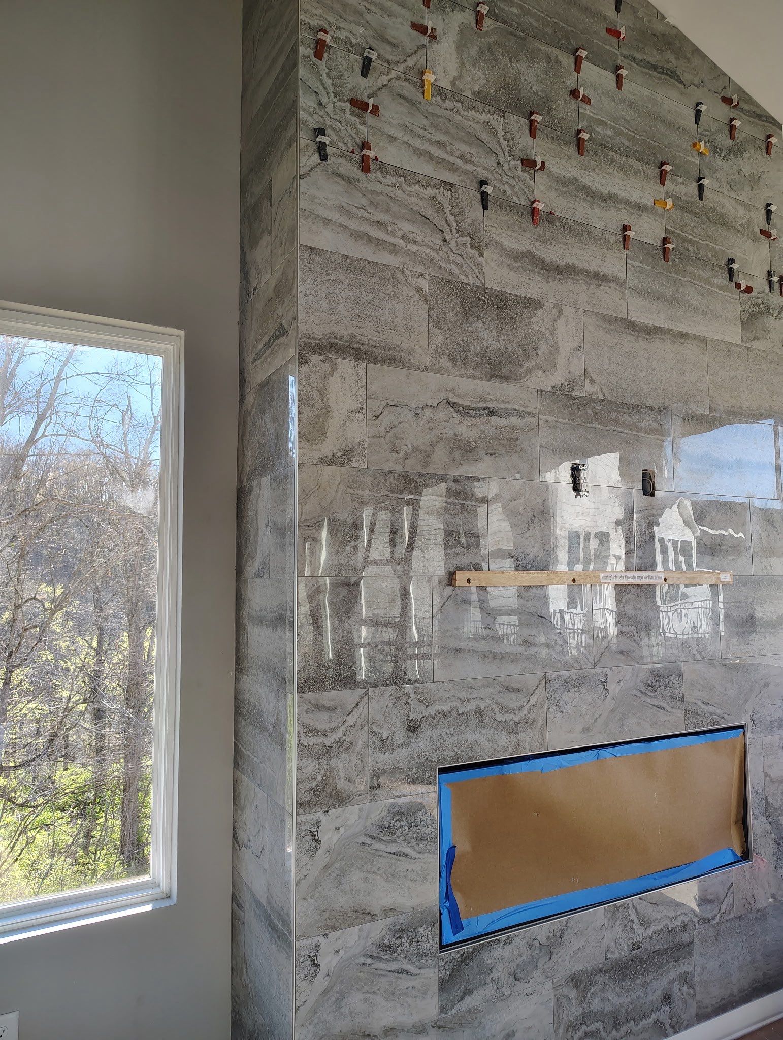 Floor to Ceiling Fireplace Surround by Footprints Floors of Nashville