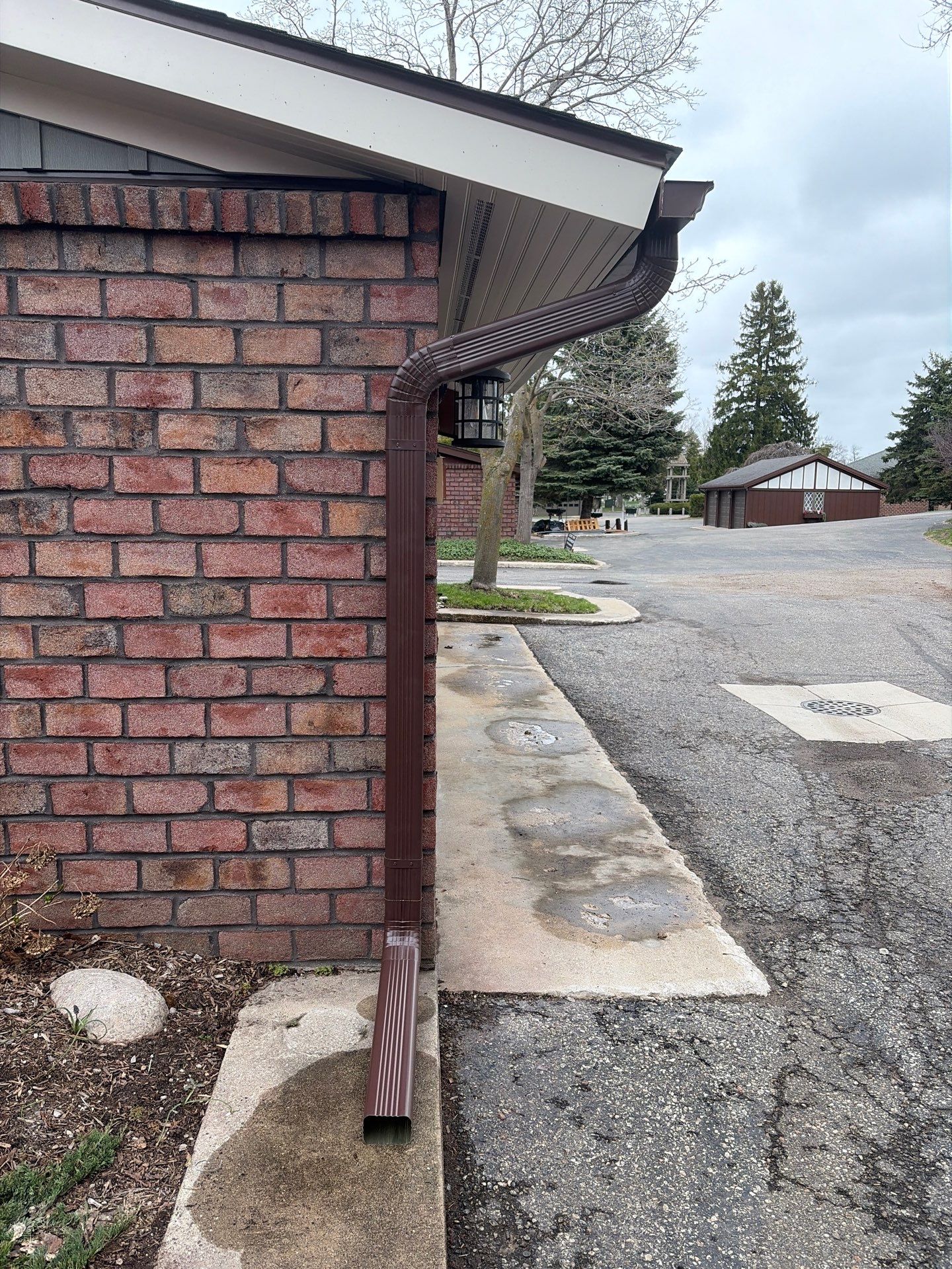 Gutter and Downspout Installation for Petoskey Residential Brick Exterior by Rainbow Seamless Systems