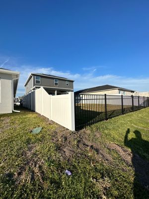Vinyl Fence Installation using Black 3 Rail Aluminum and Vinyl Privacy Fence 