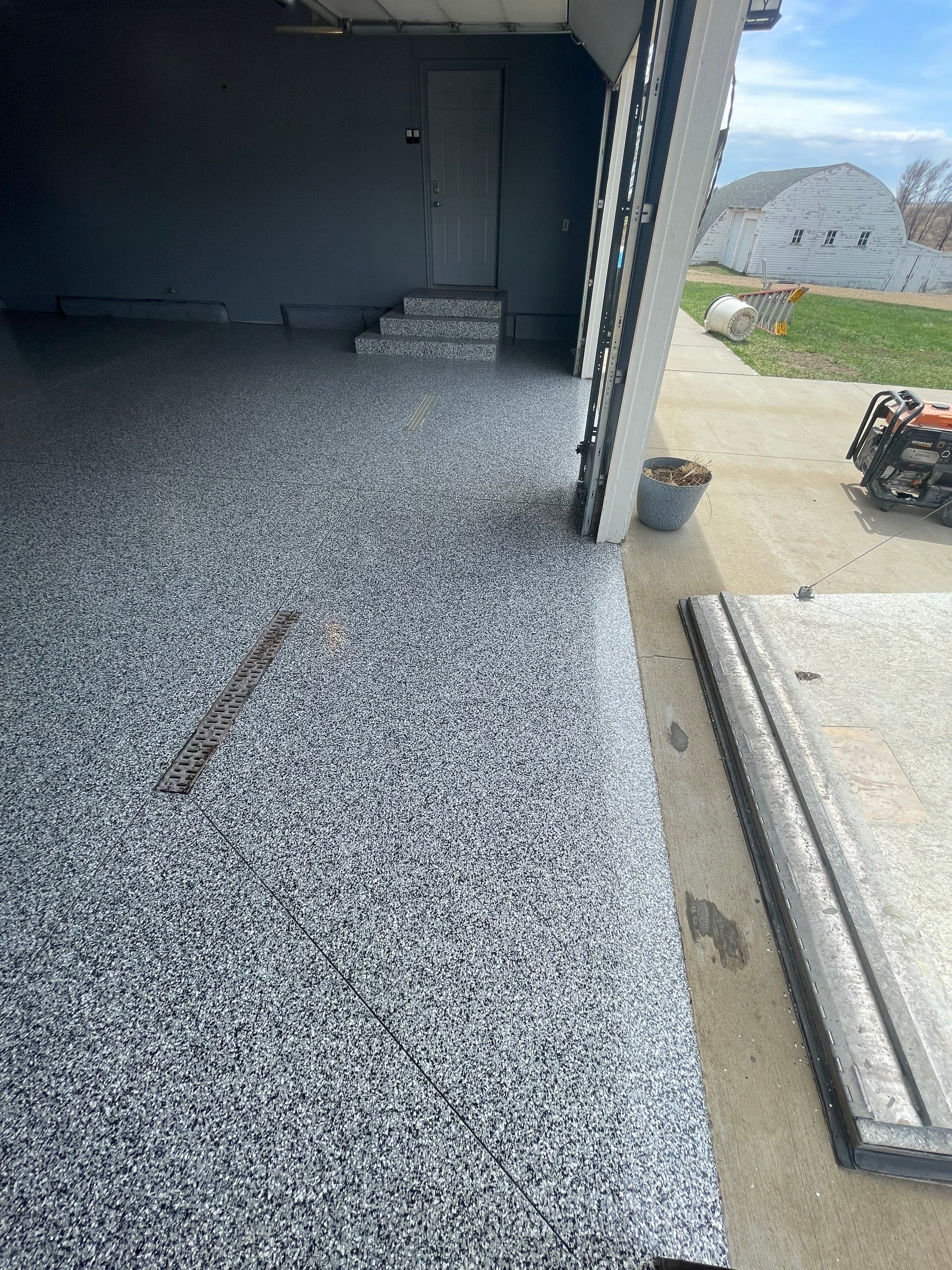 Grey Granite-Style Garage Floor Coating and Stairs in Hartford by Select Painting, Coatings & Garage Cabinets