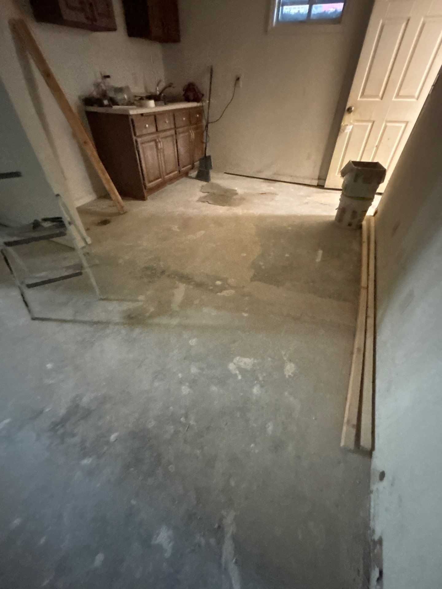 Comprehensive Basement Concrete Floor Coating and Crack Repair in Sioux Falls by Select Painting, Coatings & Garage Cabinets