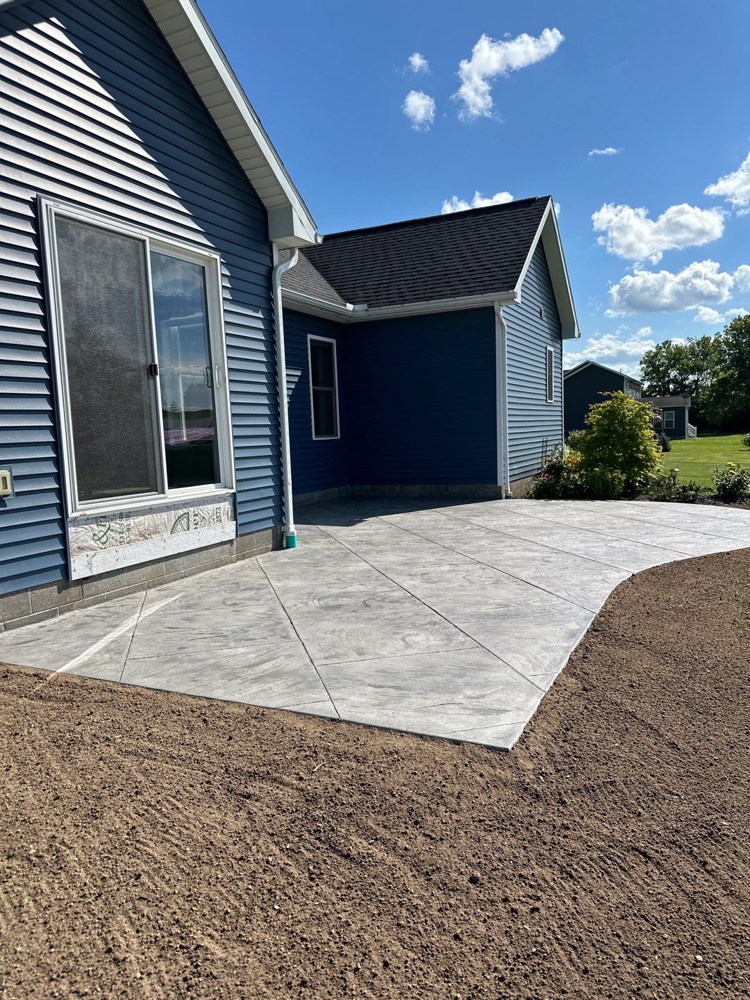 Slate stamped concrete patio  by NG Masonry & Construction LLC