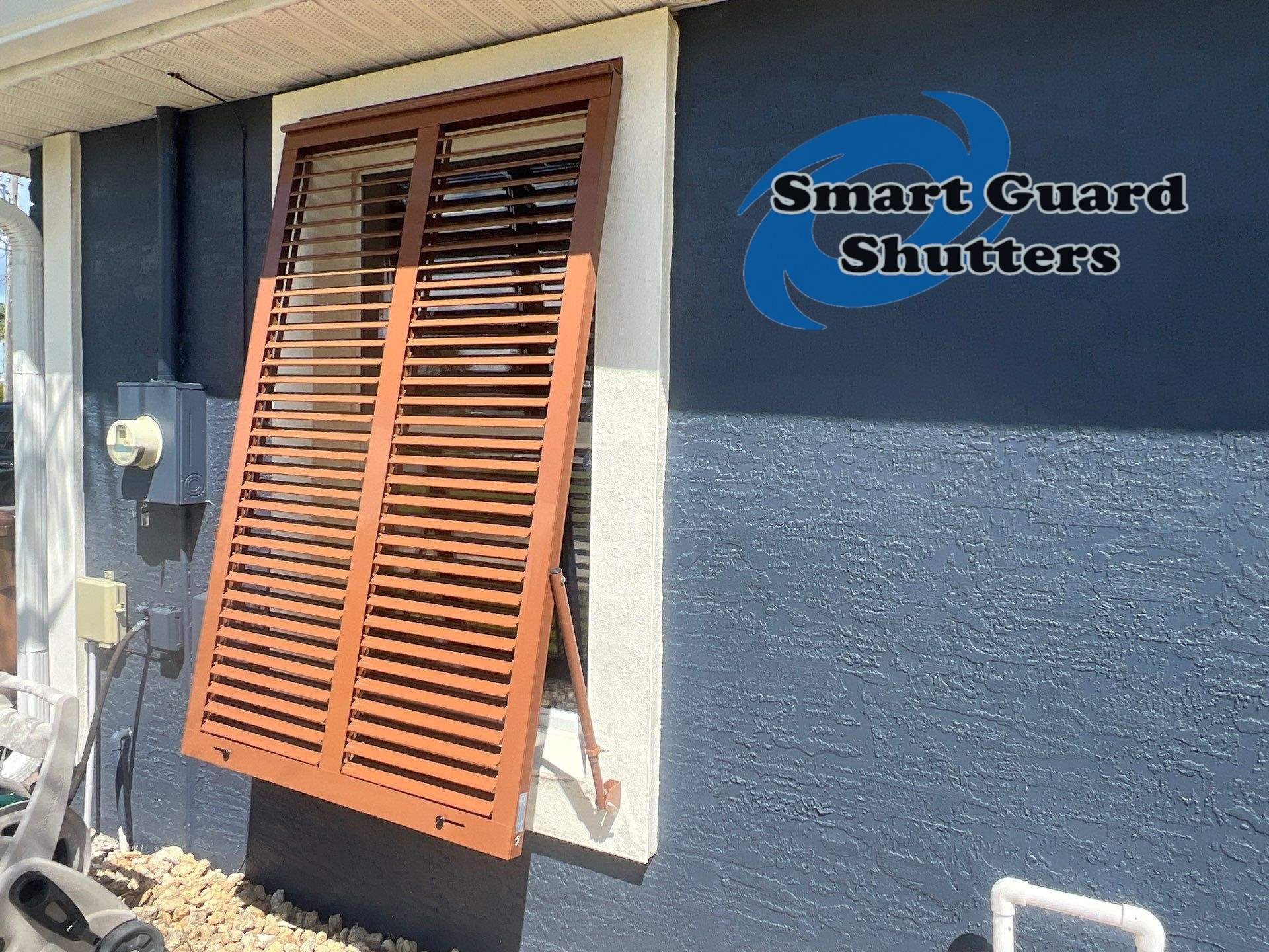 Impact Rated Bahama Shutters in Beige Brown by Smart Guard Shutters