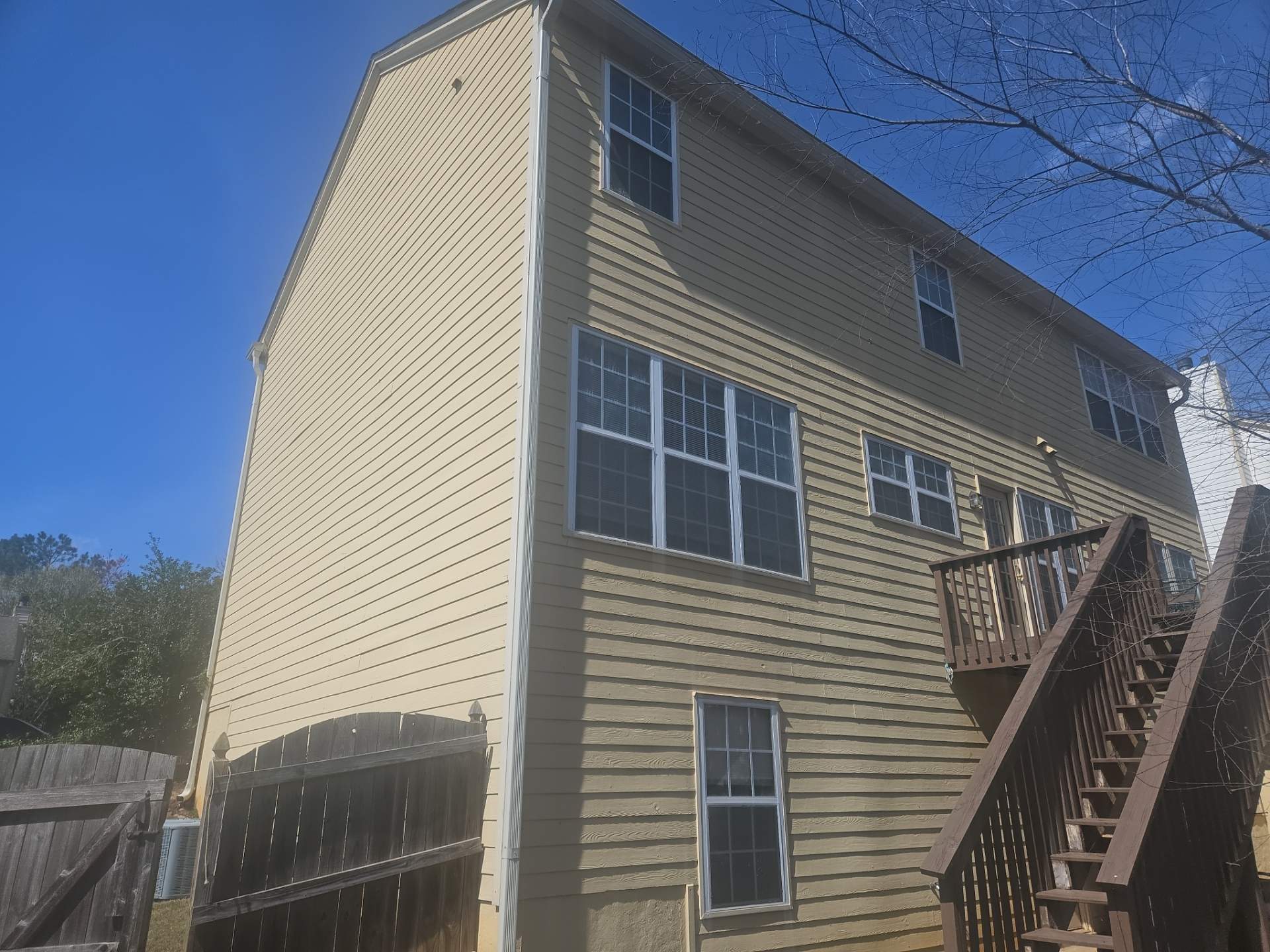 Rotten Wood Replacement Plus Stucco & Siding Painting  by Nelson Exteriors 