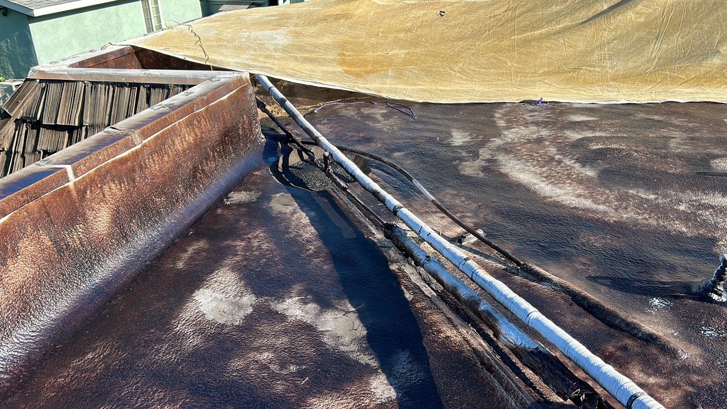 Foam Refurbish using Conklin Benchmark/PUMA XL coatings and spray foam; Also metal roofing around parapet wall by Straight Edge Roofing Inc