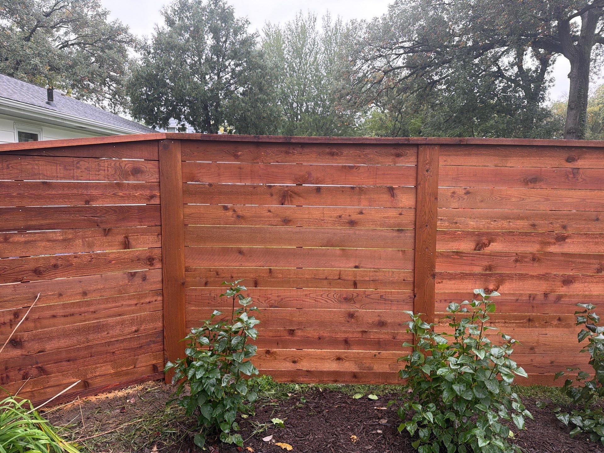 Stained Horizontal Cedar Wood Privacy Fence in Cedar Falls by Perfect Picket Fence and Stain