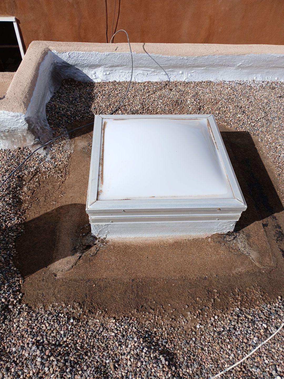 Roof Maintenance and Low-E Tempered Glass Skylight Replacement on Gravel Roof in Northwest Albuquerque by Doyle Roof Masters Inc