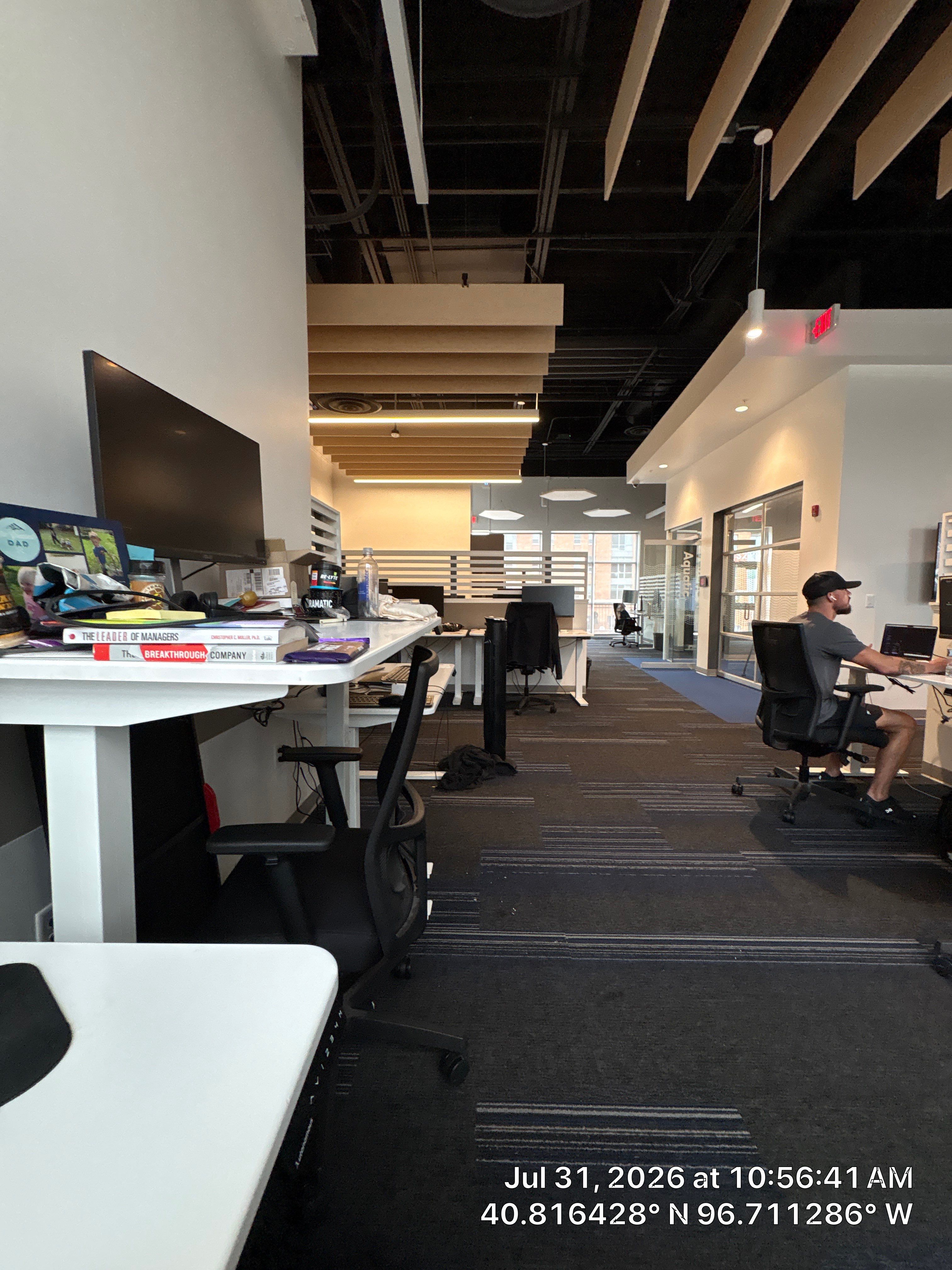 Modern Open-Plan Office Remodel with Acoustic Ceiling Baffles by CompanyCam Sales Demo