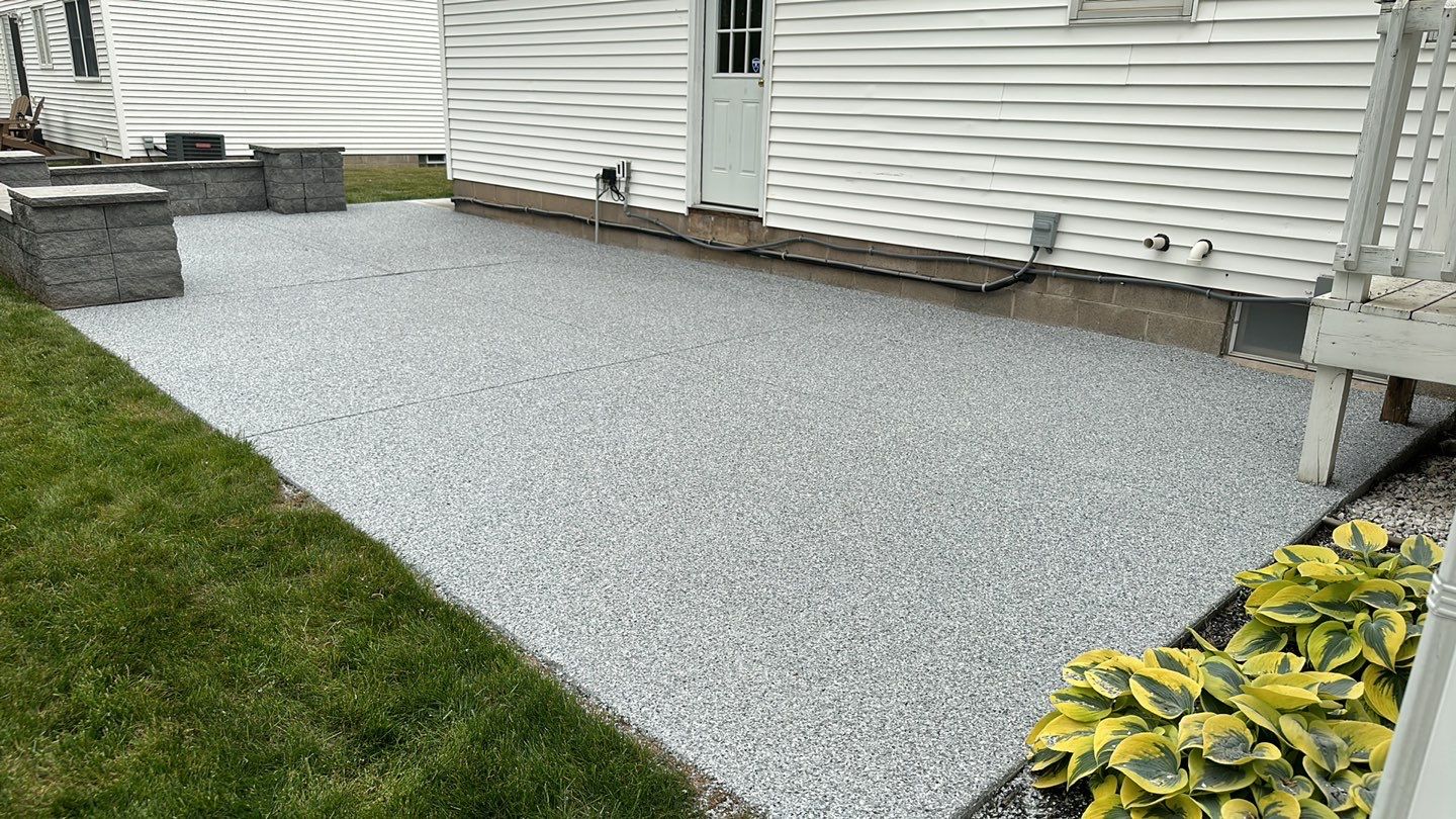 Silverado garage floor and patio coating  by NG Masonry & Construction LLC