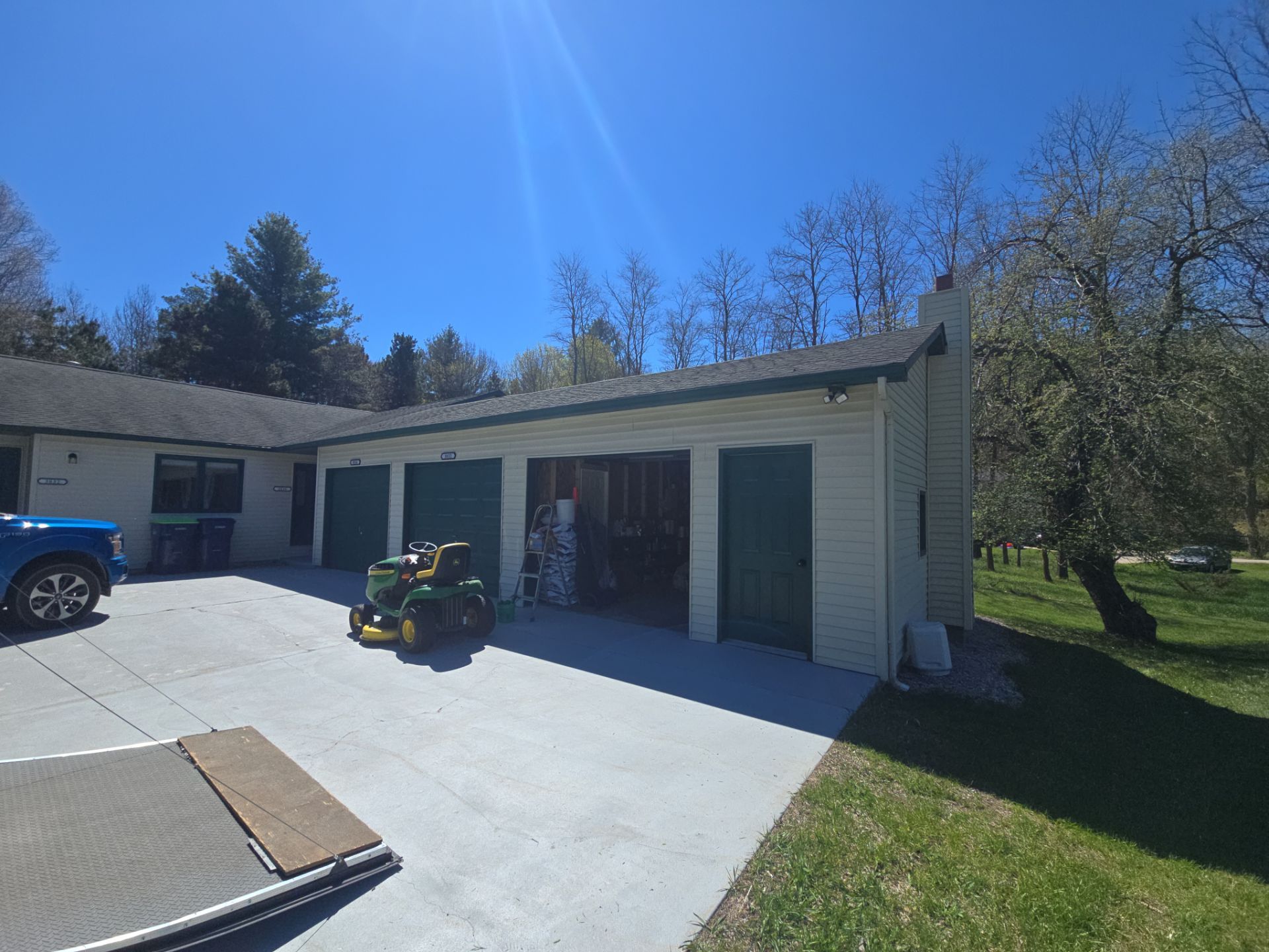 Gutter and Downspout Installation for Residence and Detached Garage in Traverse City by Rainbow Seamless Systems