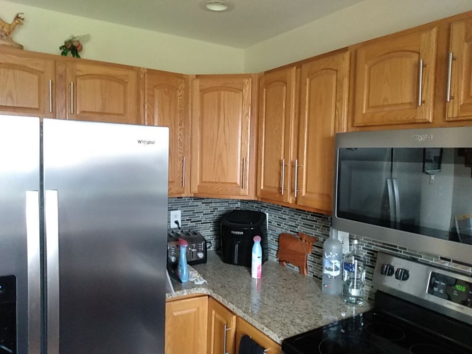 Kitchen cabinet repaint by Cutting edge painting 
