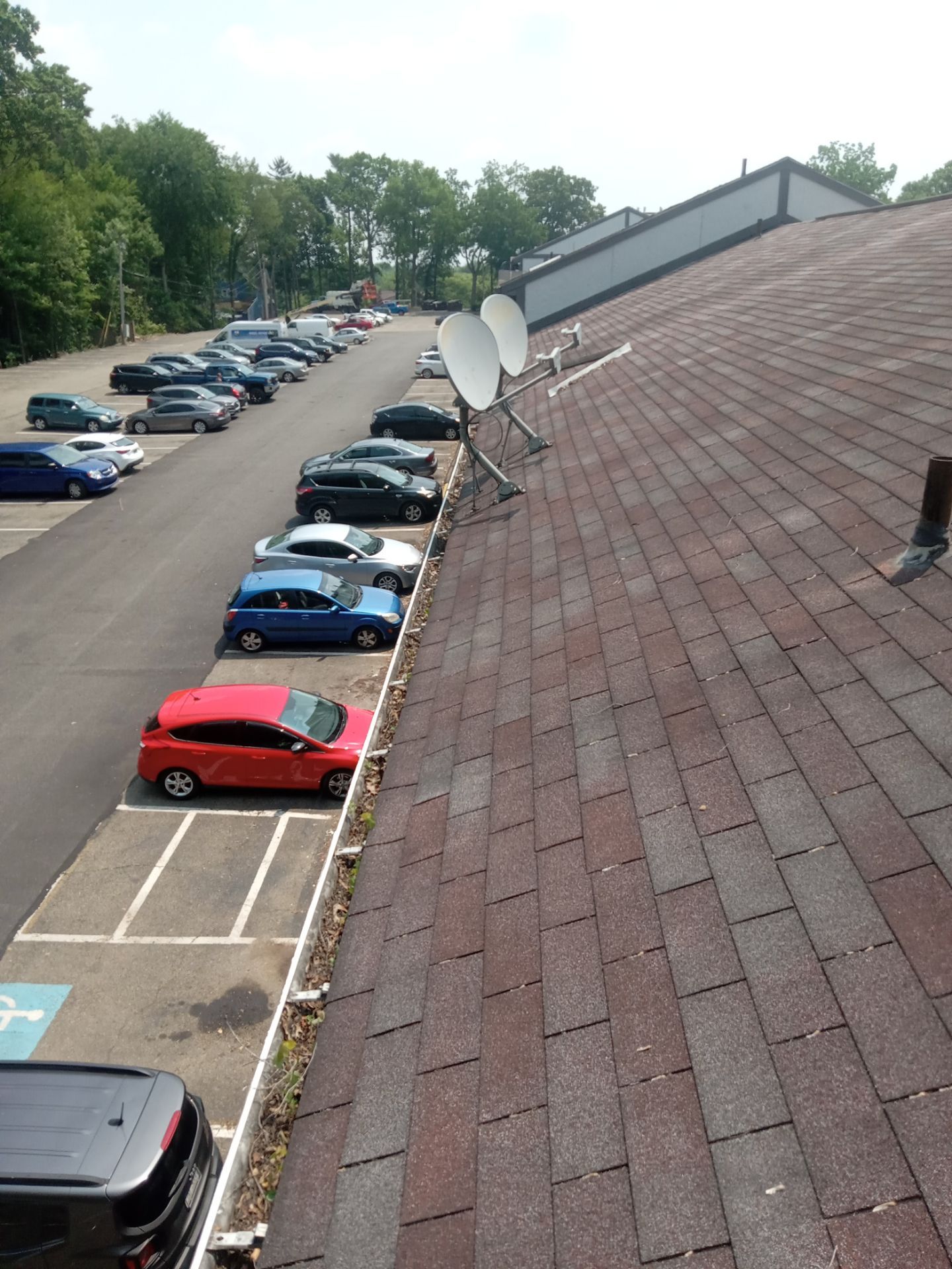 Commercial gutter cleaning Canton, OH before photo with filled gutters