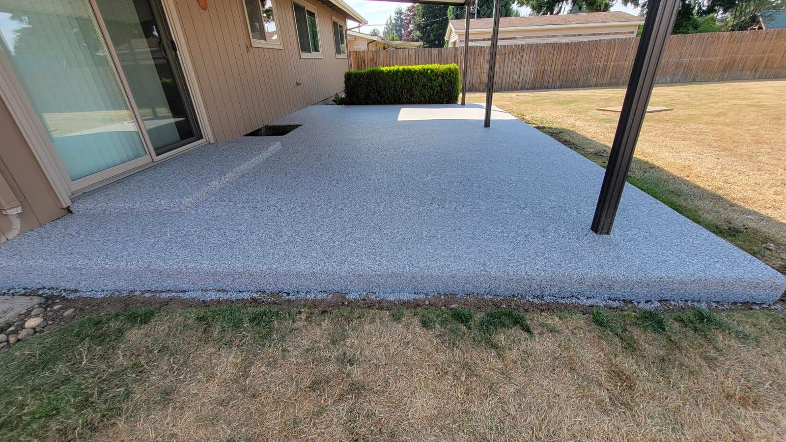 Coastal Elegance Patio in PoseidonVuba Stone by Concrete Coating Experts Inc.