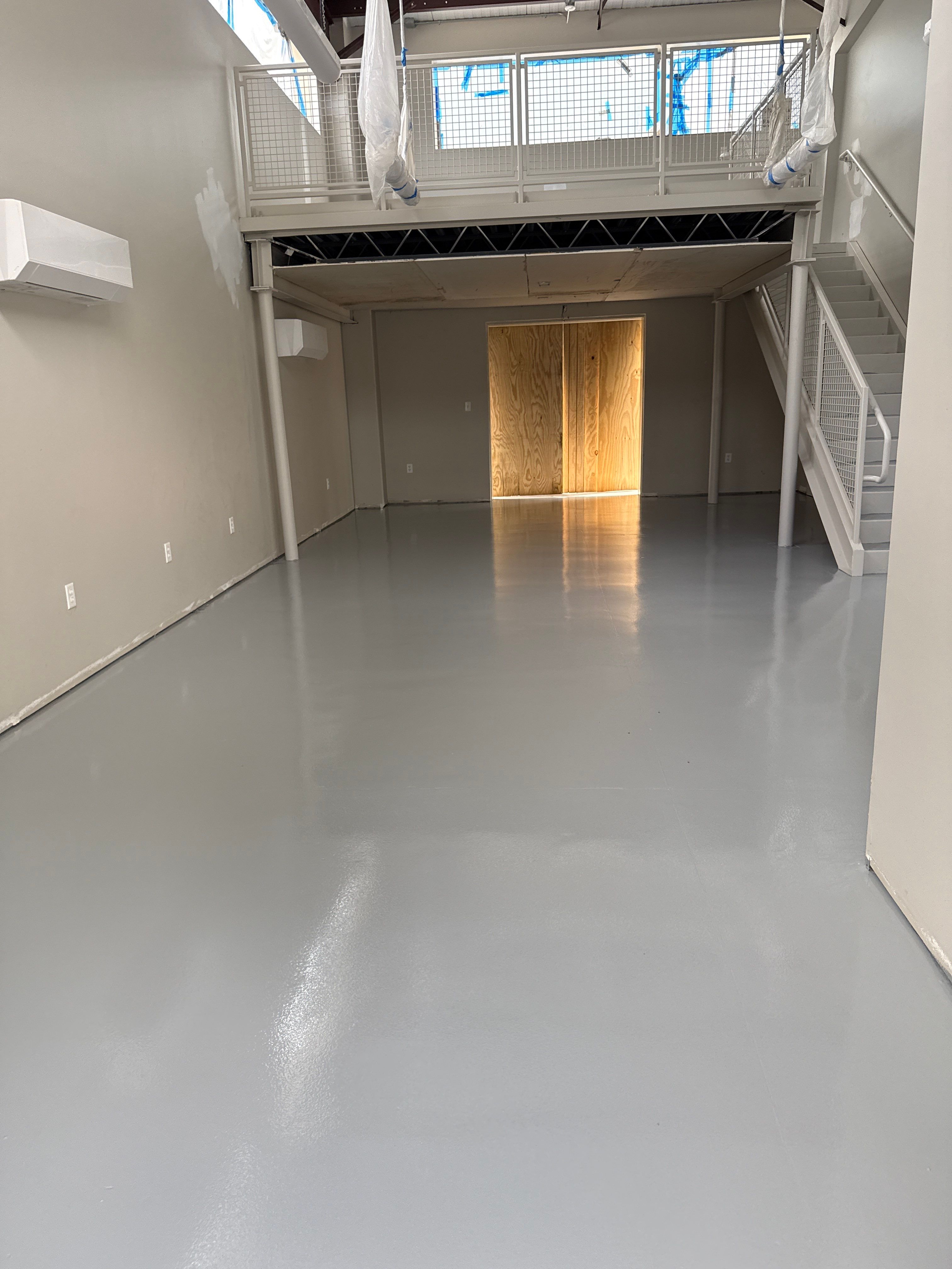 Industrial Epoxy Flooring for Sandhill Crane Workshop in Gautier by Cornerstone Hard Surface Restoration 
