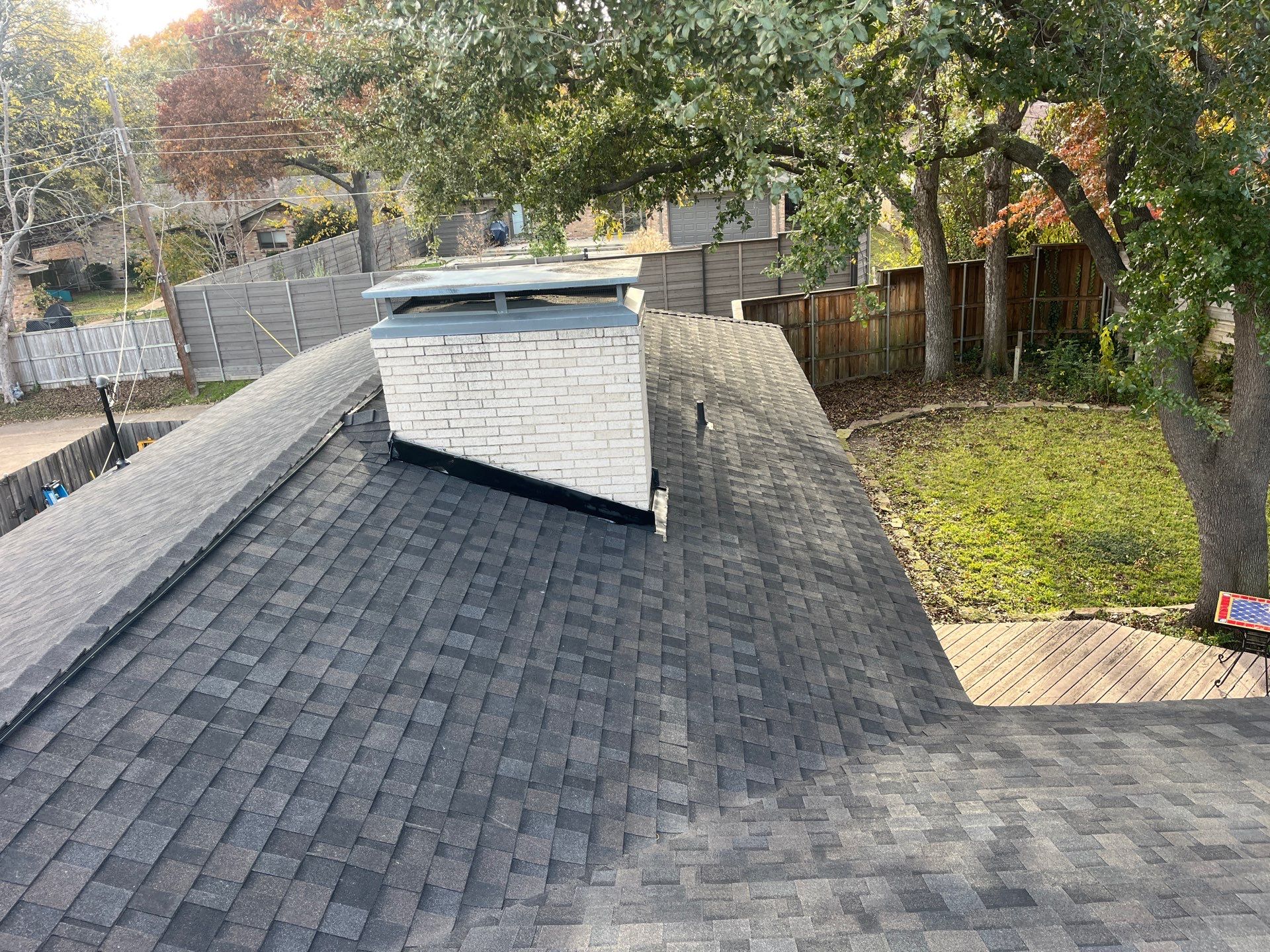 IKO Brownstone- White Brick  by Tejas Roofworks + Restoration