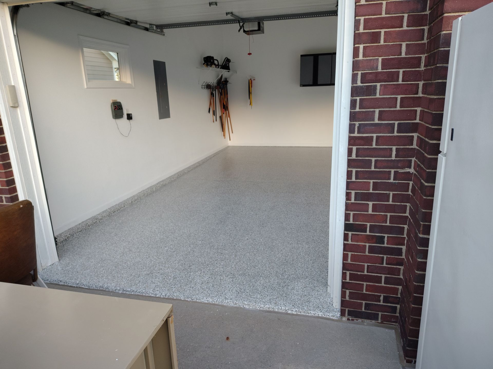 New Johnston Garage Resurfacing by Revival Concrete Coatings, LLC