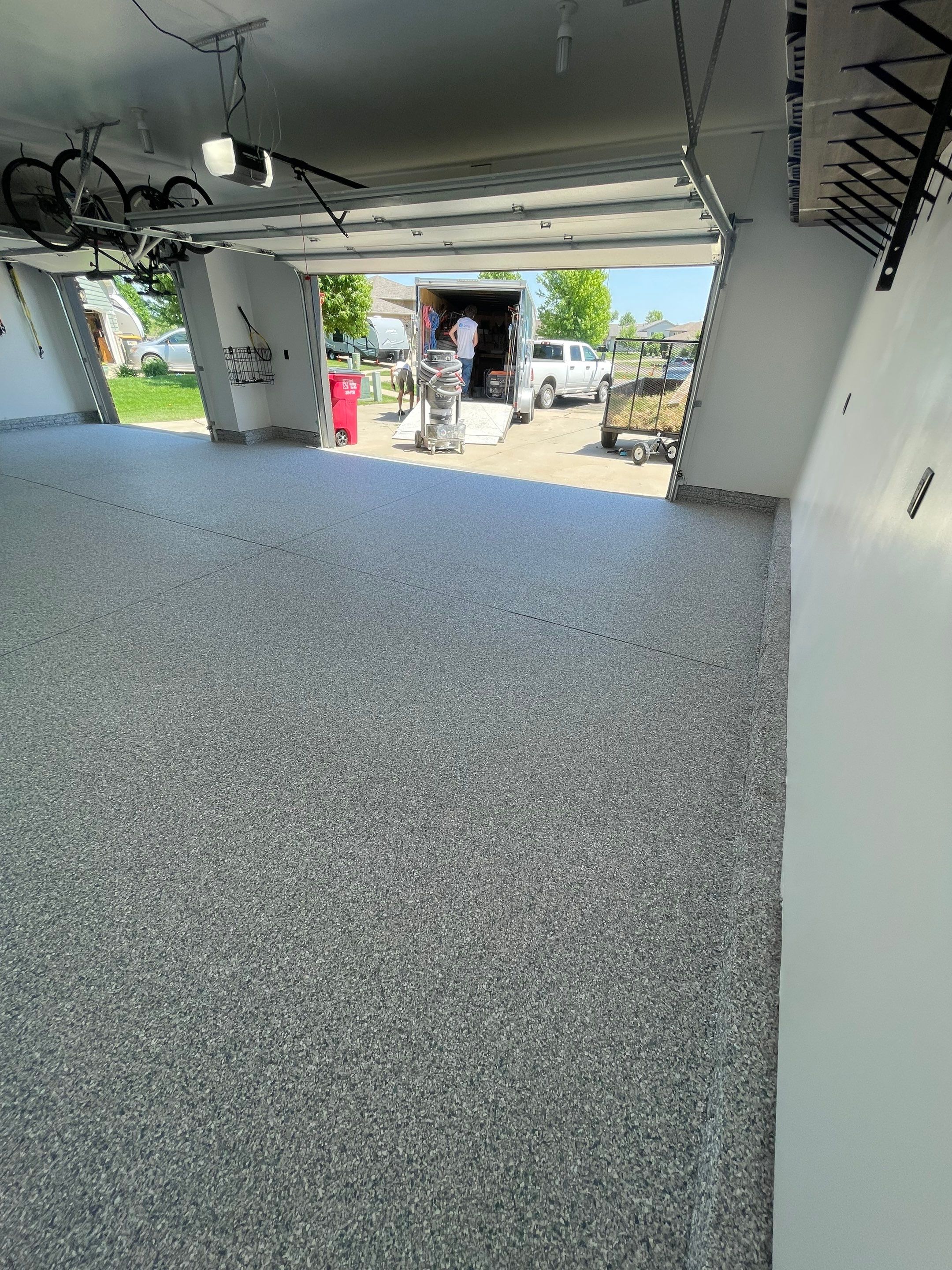 Tidal Wave Flake Garage Floor Installation in Sioux Falls by Select Painting, Coatings & Garage Cabinets