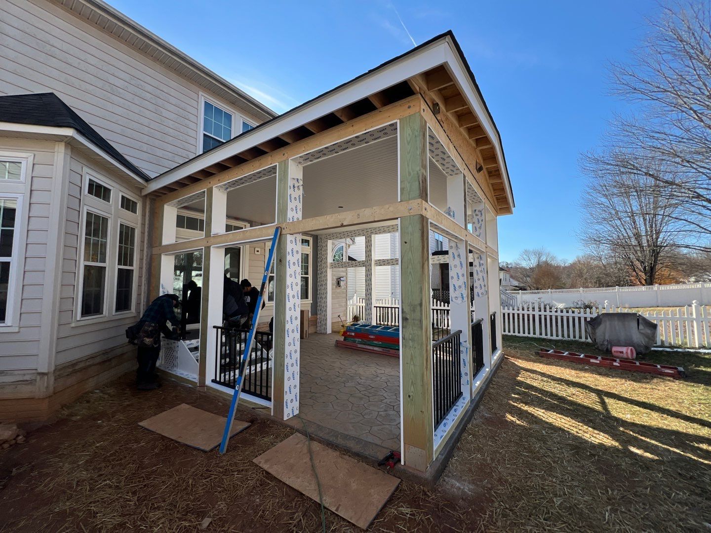 Custom Screened-In Porch with Stamped Concrete Patio in Warrenton by Jakari Restoration & Construction LLC