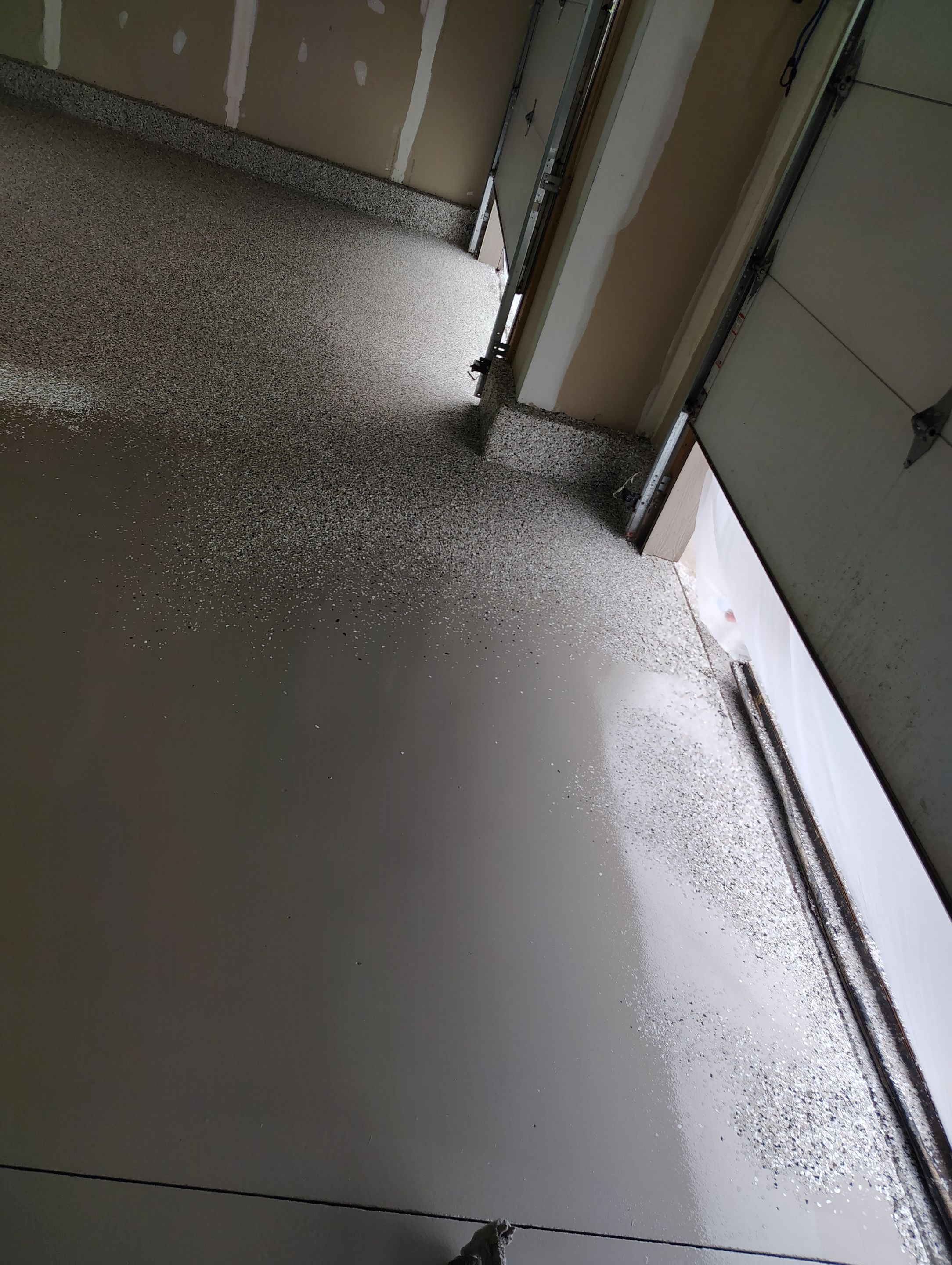 Multi-Car Garage Concrete Coating and Epoxy Finish in Sioux Falls by Select Painting, Coatings & Garage Cabinets