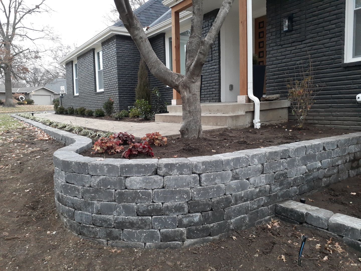 Entire Home Landscape and Retaining Walls by LAND ESCAPES LLC