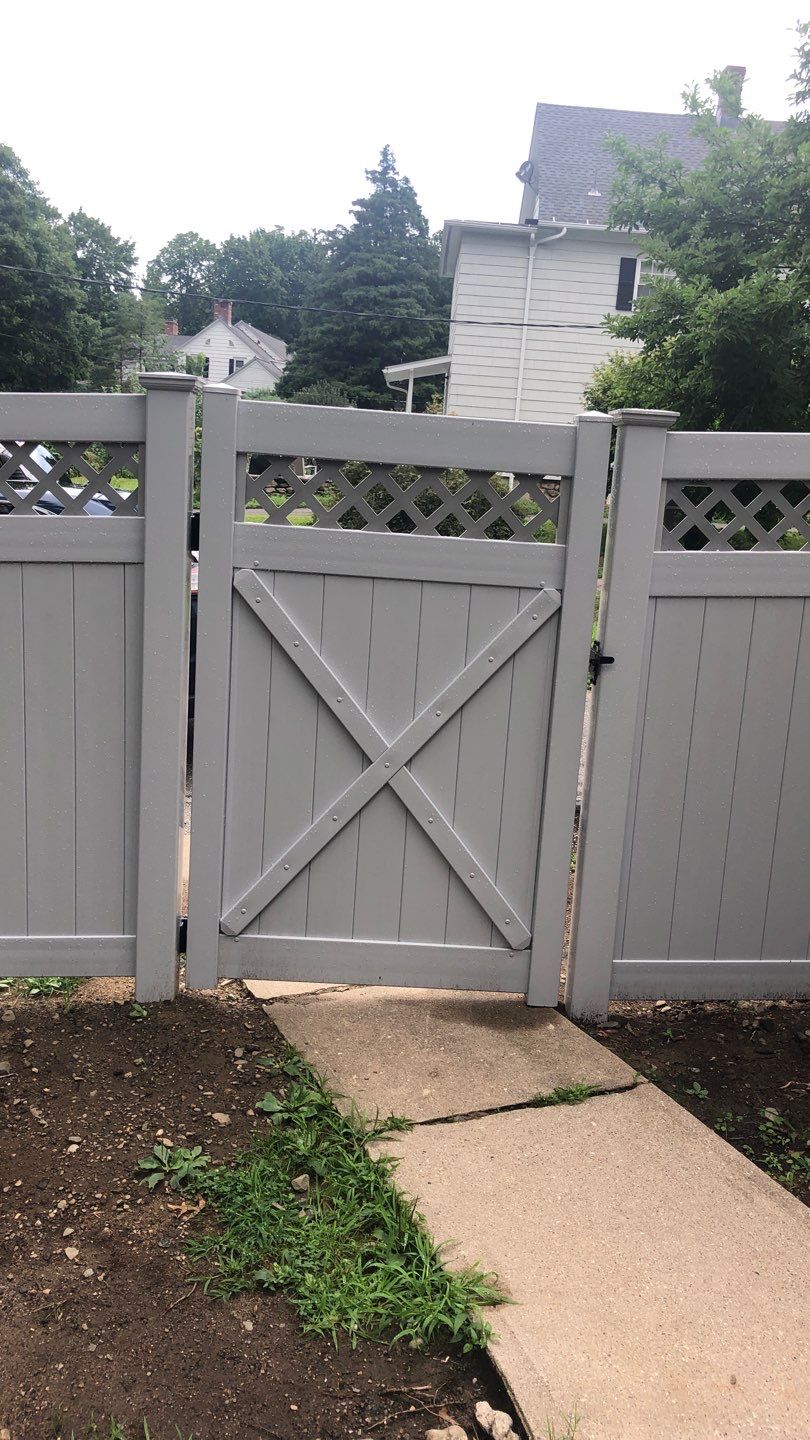 Vinyl Privacy Fence with Lattice top, matching gate in White by DiGiorgi Roofing and Siding Inc