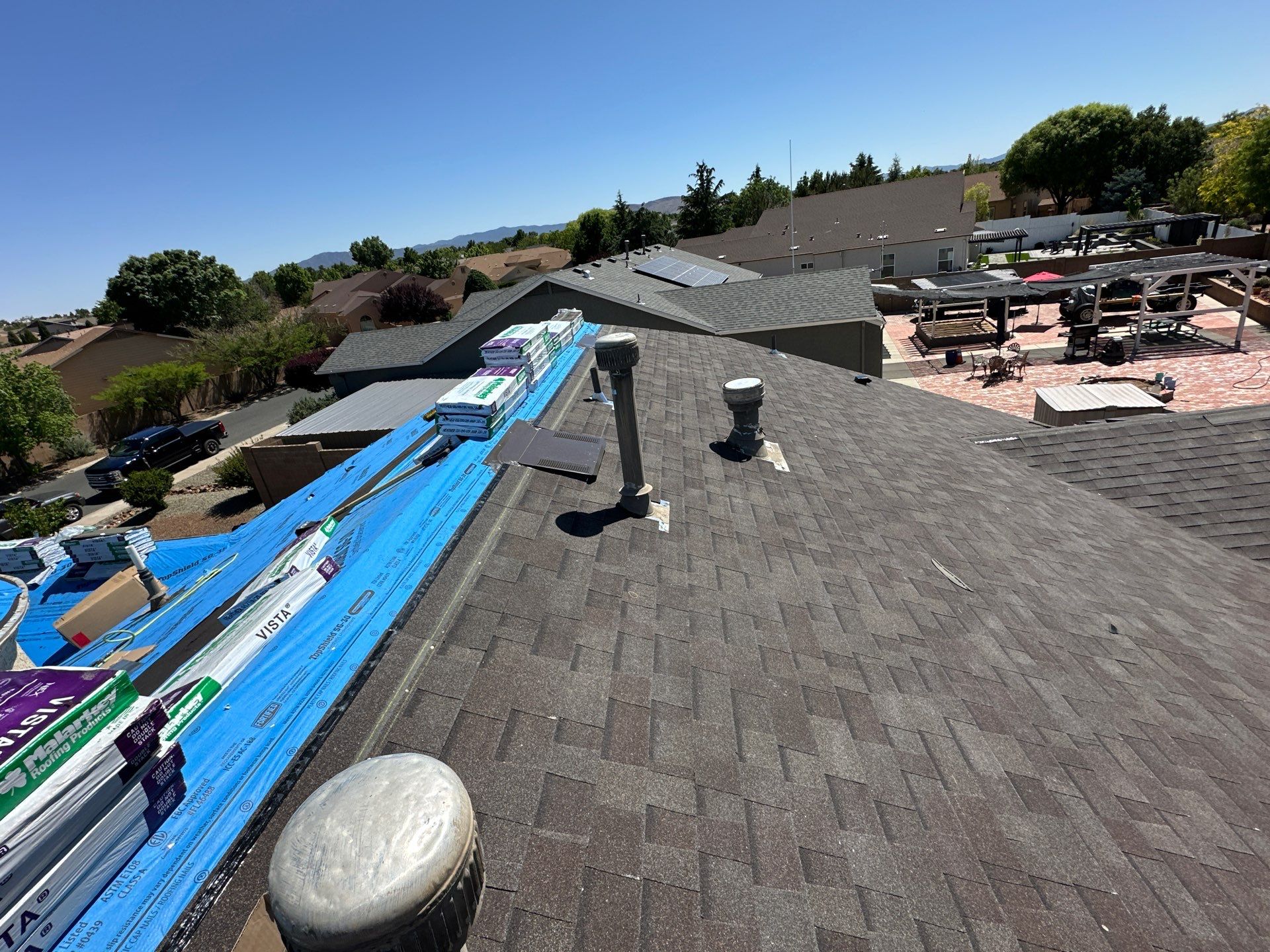 Residential Roofing Installation with Architectural Shingles and Turret Detail by Badger Roofing