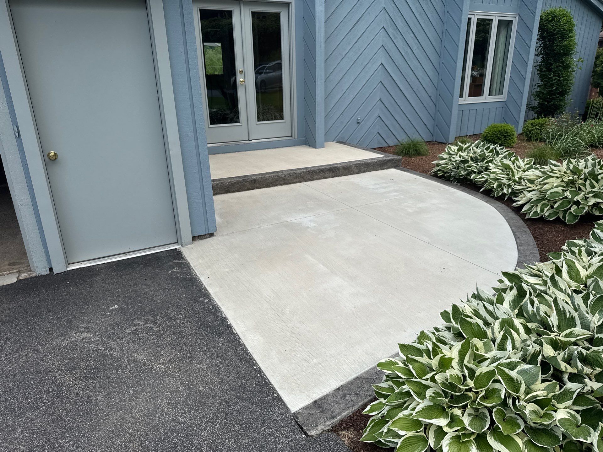 Charcoal Release Border with Broom Finish  by NG Masonry & Construction LLC