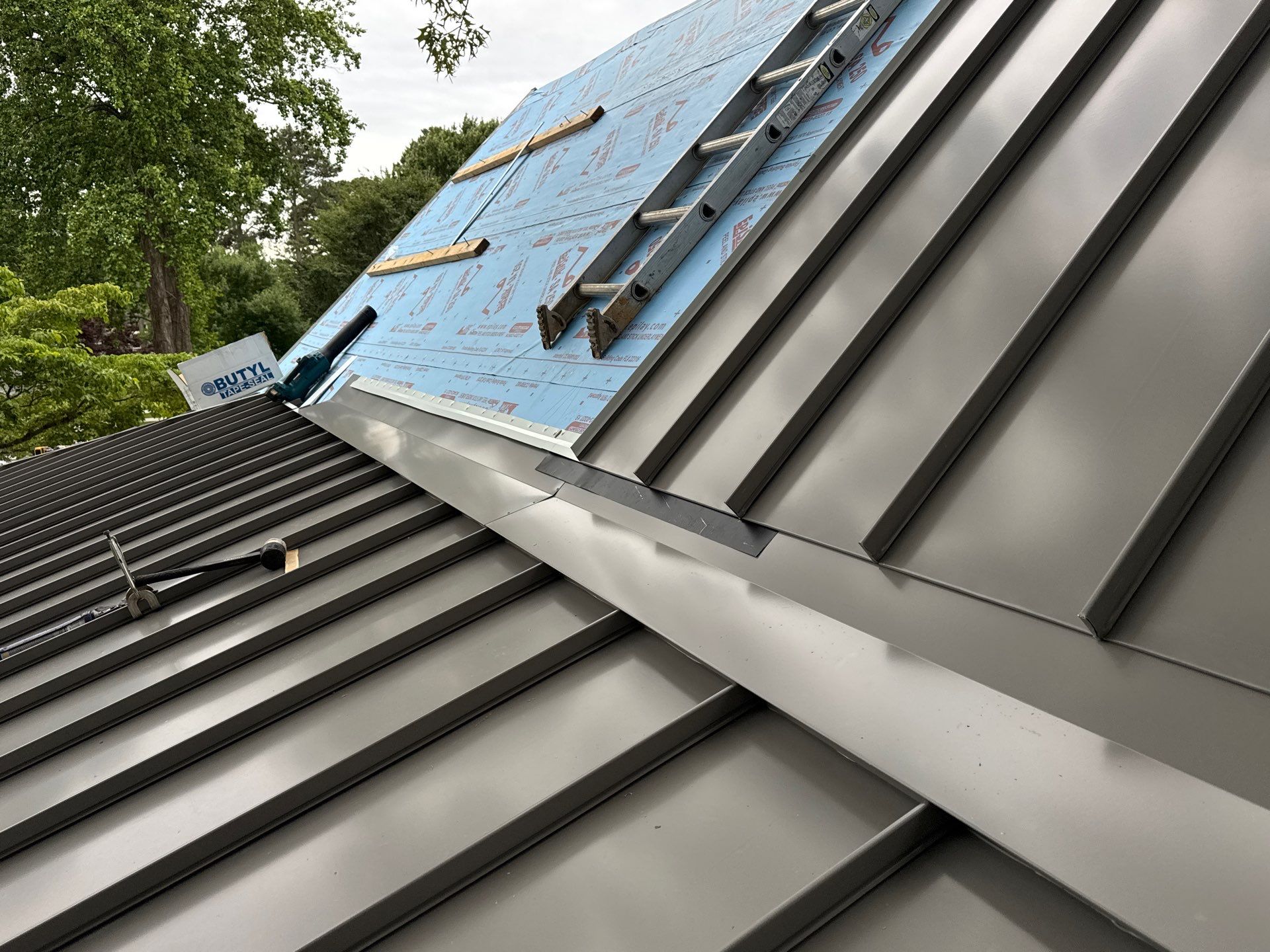 Custom New Construction Metal Roof Installation in Deltaville by Cade Construction