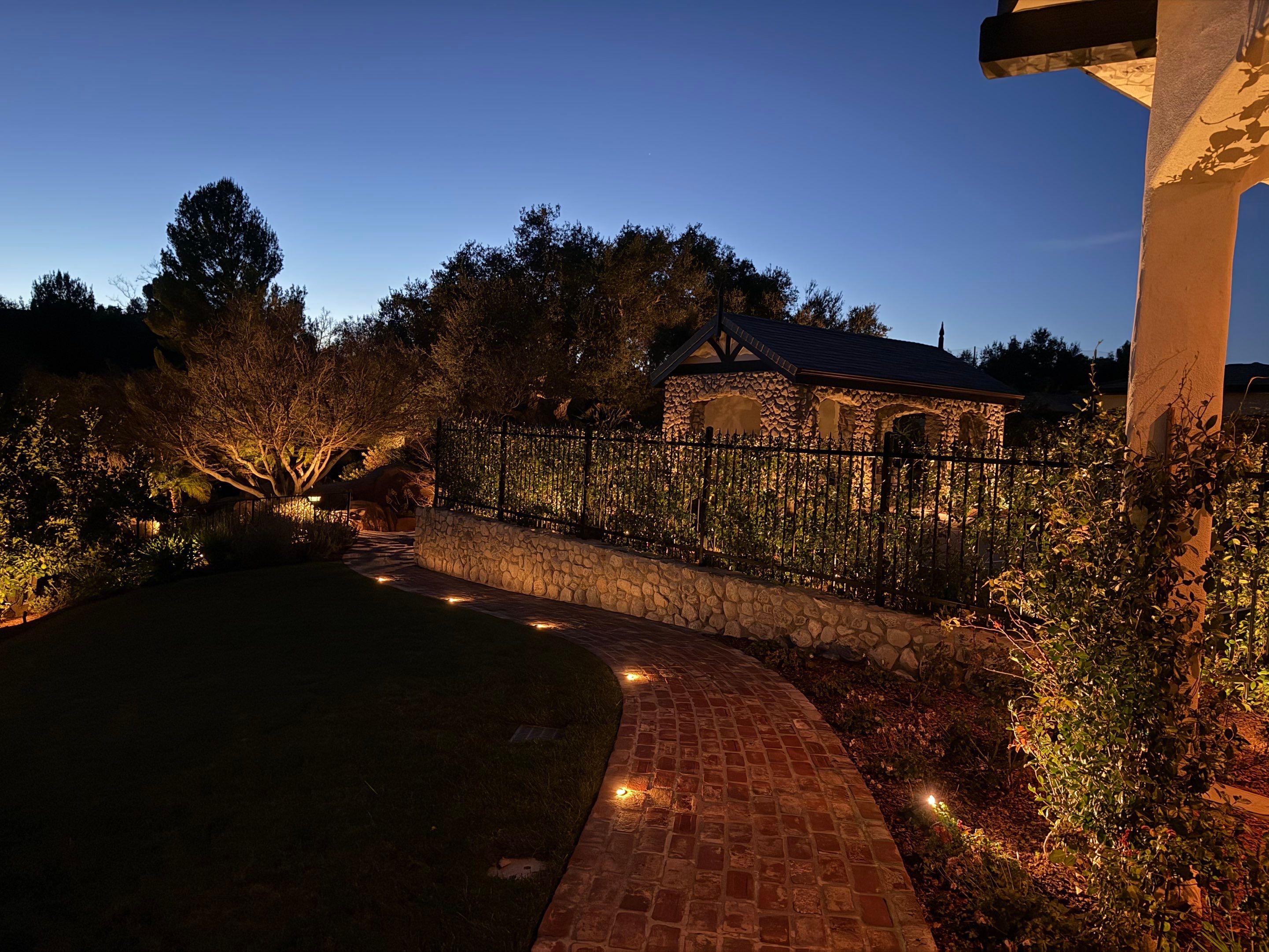 Tudor Estate Landscape Lighting with Integrated Stone Step Illumination by Outdoor Lights + Shades