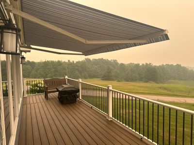 Sunesta Retractable Awning Installation over Charlevoix Deck