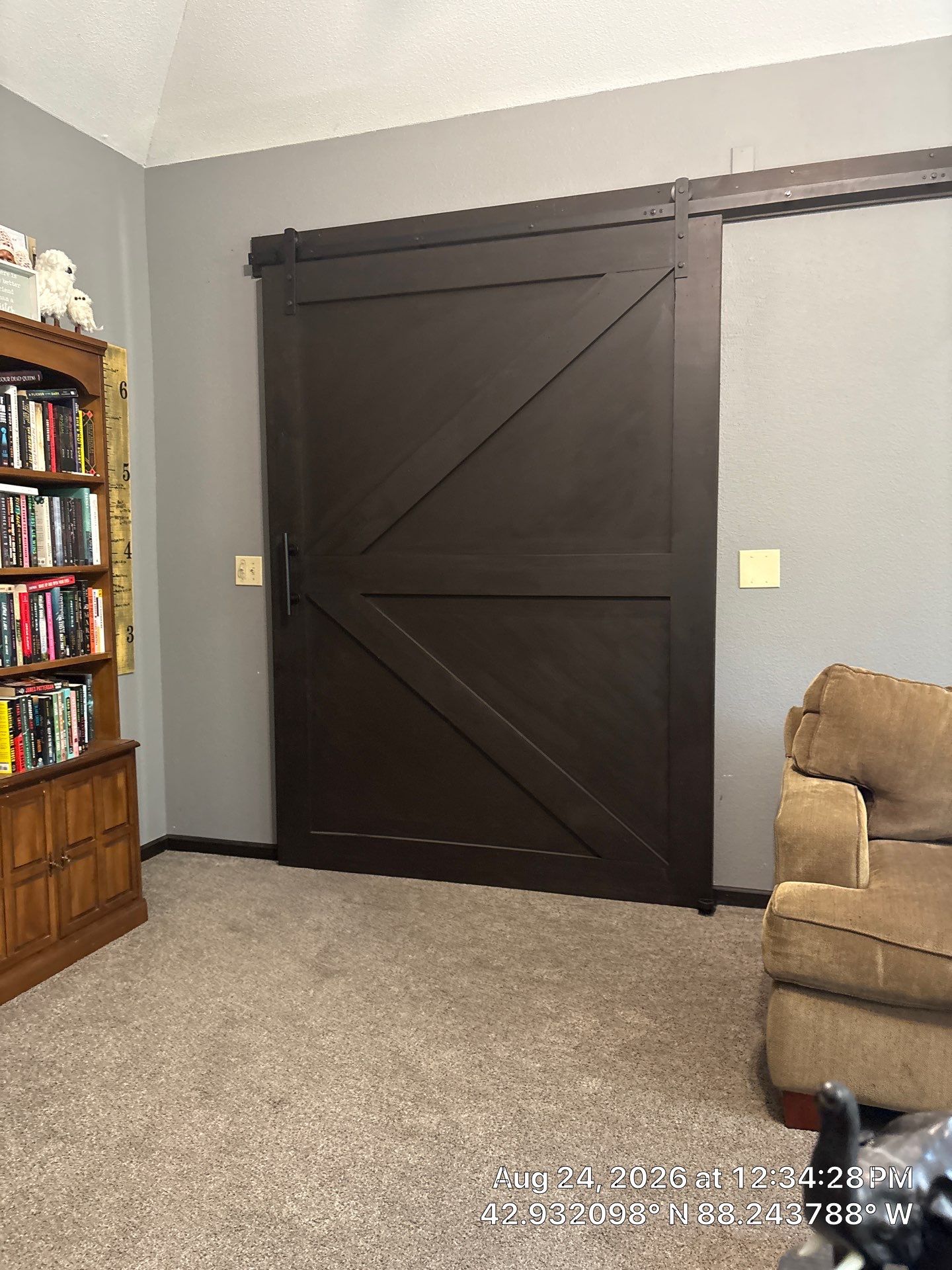 Dark Stained Sliding Barn Door Installation in Waukesha by CompanyCam Sales Demo
