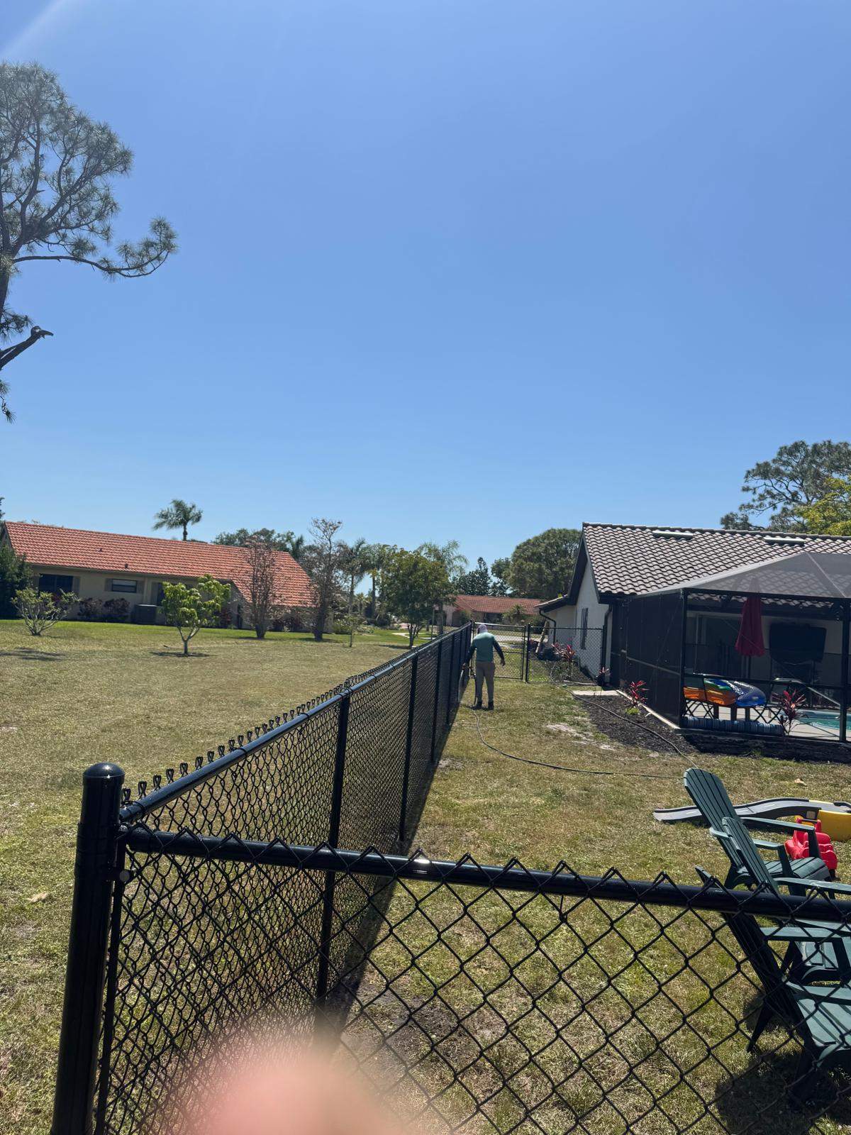 Black Chain Link Residential Backyard Fence Installation in North Port by True Fence LLC