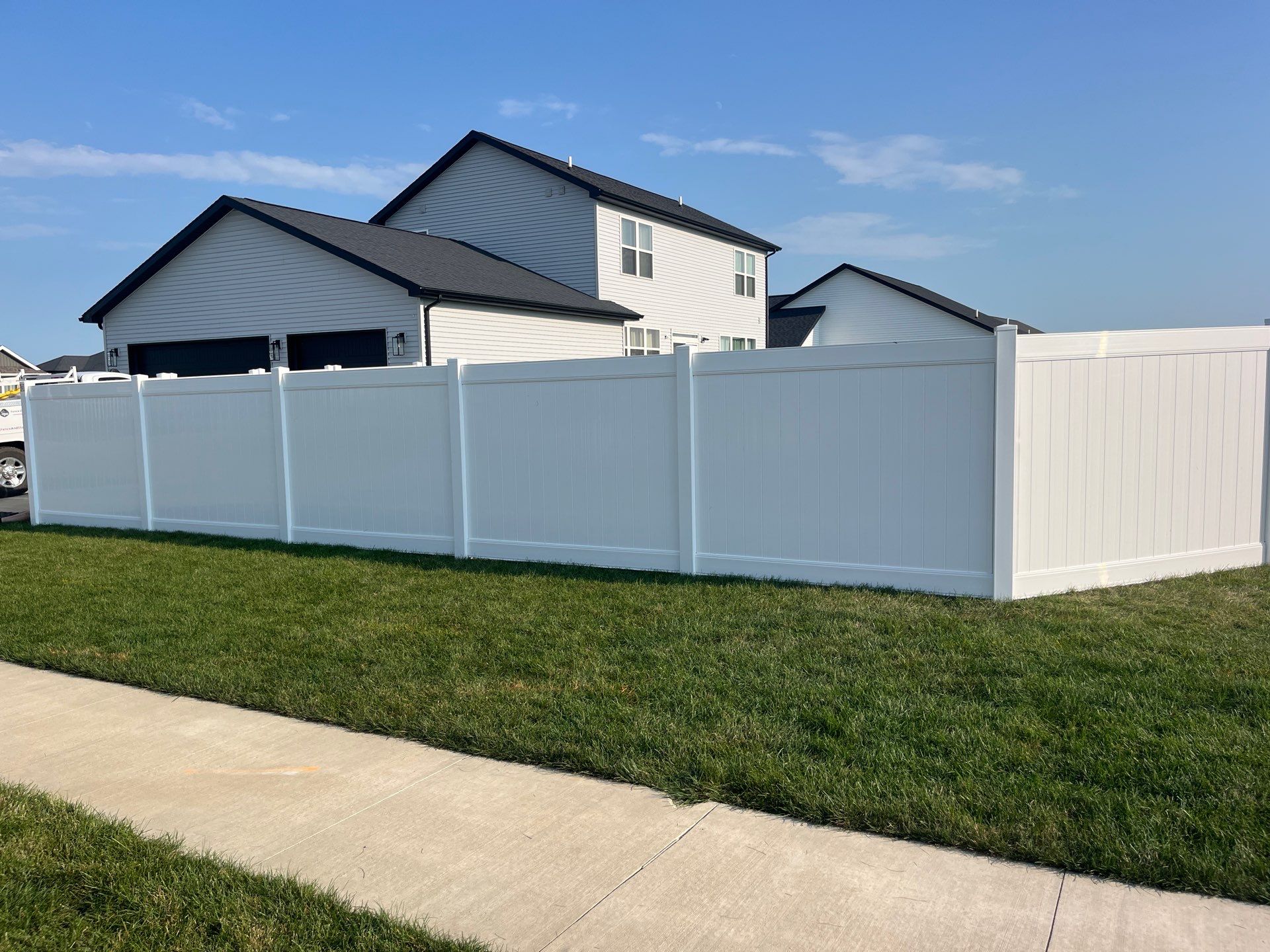White Vinyl Privacy Fence Installation With Double Gates in Waterloo by Perfect Picket Fence and Stain